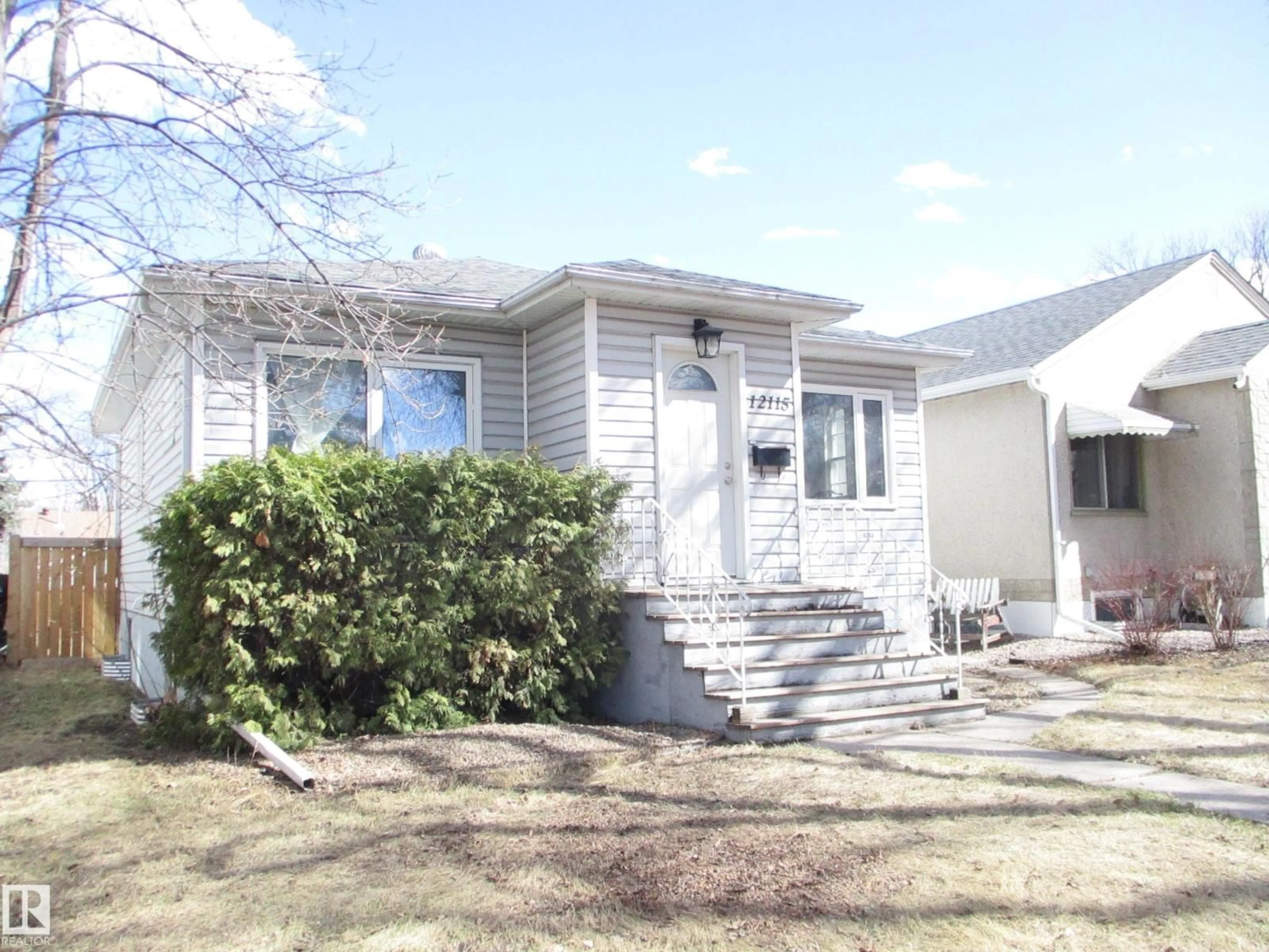 Home with vinyl exterior material, street for 12115 64 ST, Edmonton Alberta T5W4J8