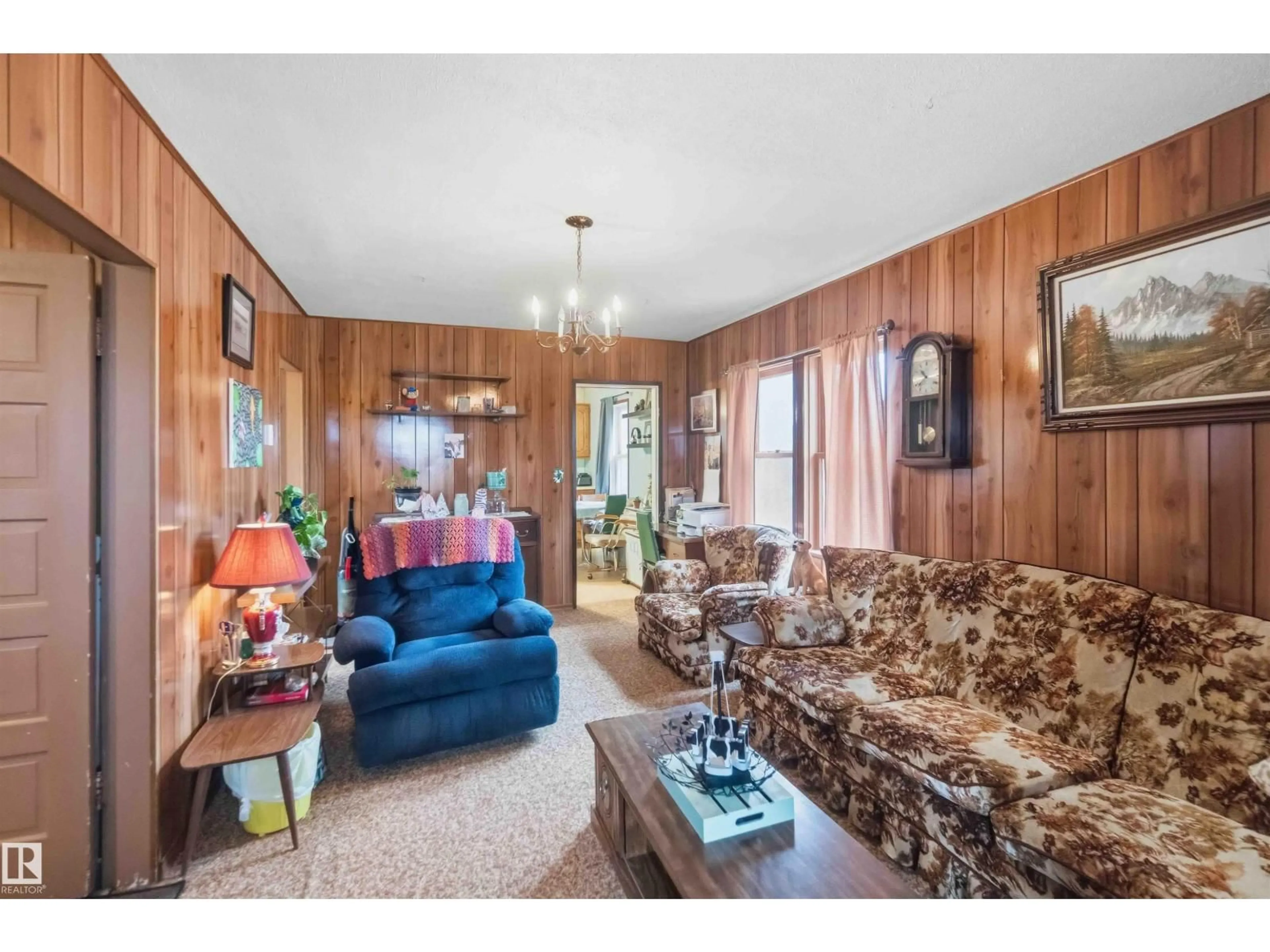 Living room with furniture, wood/laminate floor for 58211 RR 215, Rural Thorhild County Alberta T0A2W0