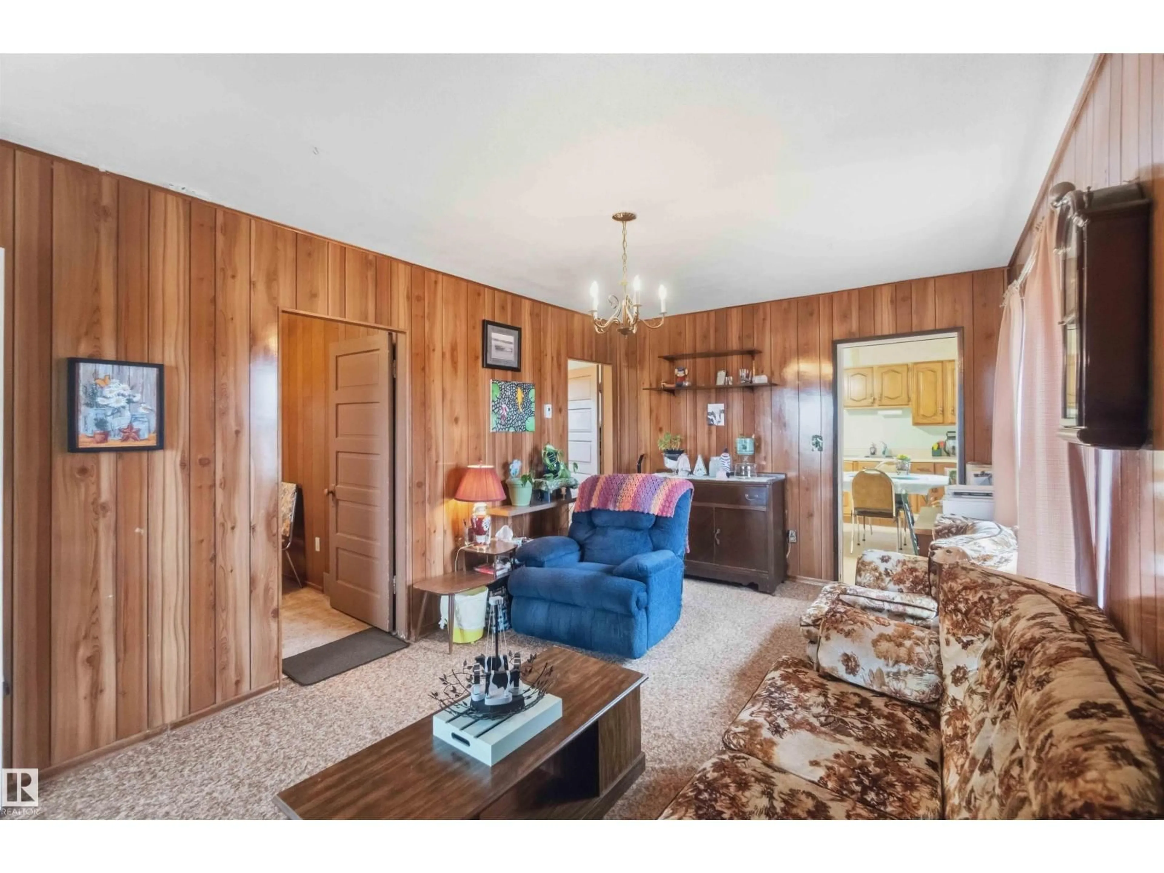 Living room with furniture, wood/laminate floor for 58211 RR 215, Rural Thorhild County Alberta T0A2W0