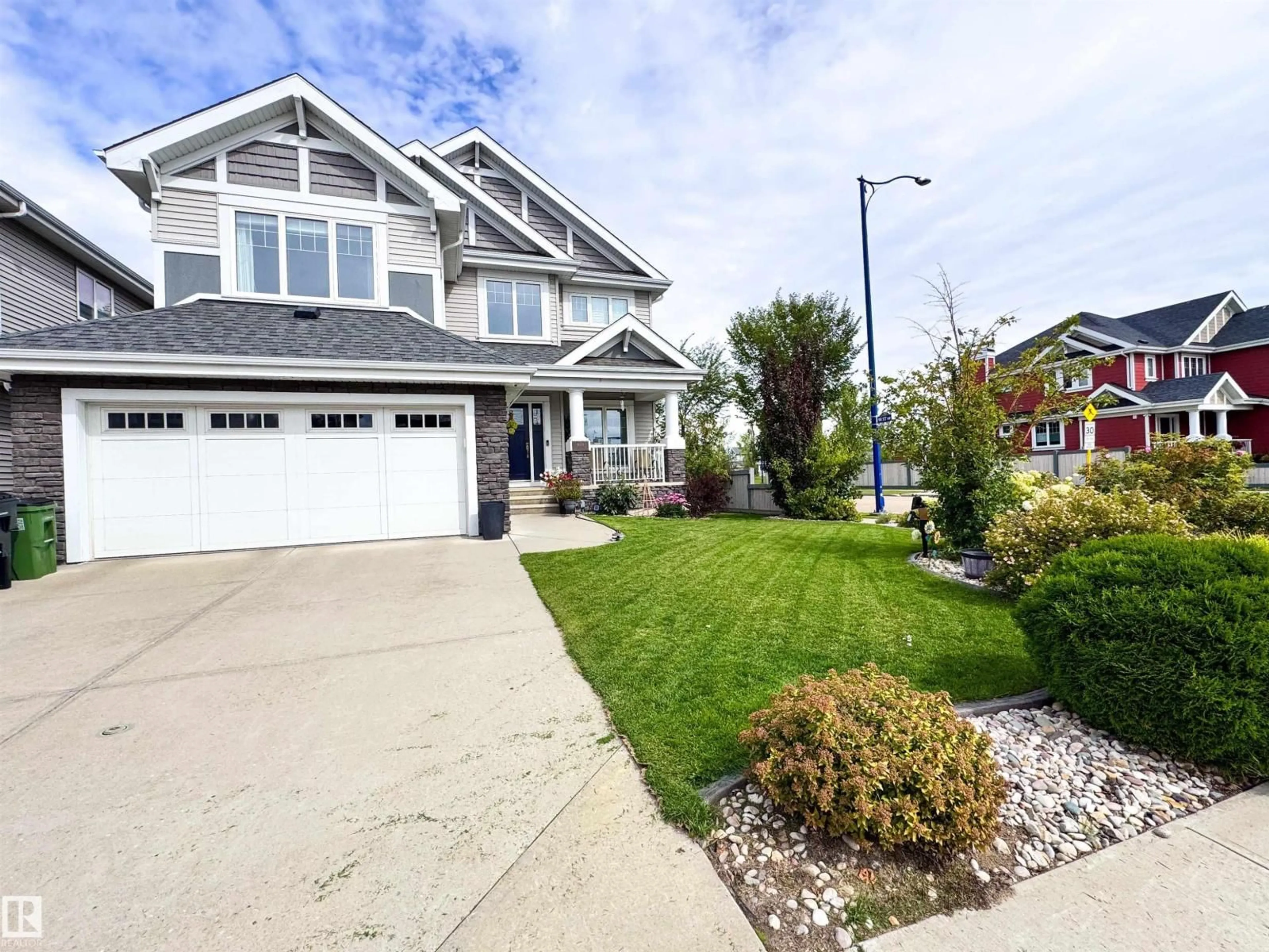 Home with vinyl exterior material, street for SW - 9004 24 AV, Edmonton Alberta T6X1A6