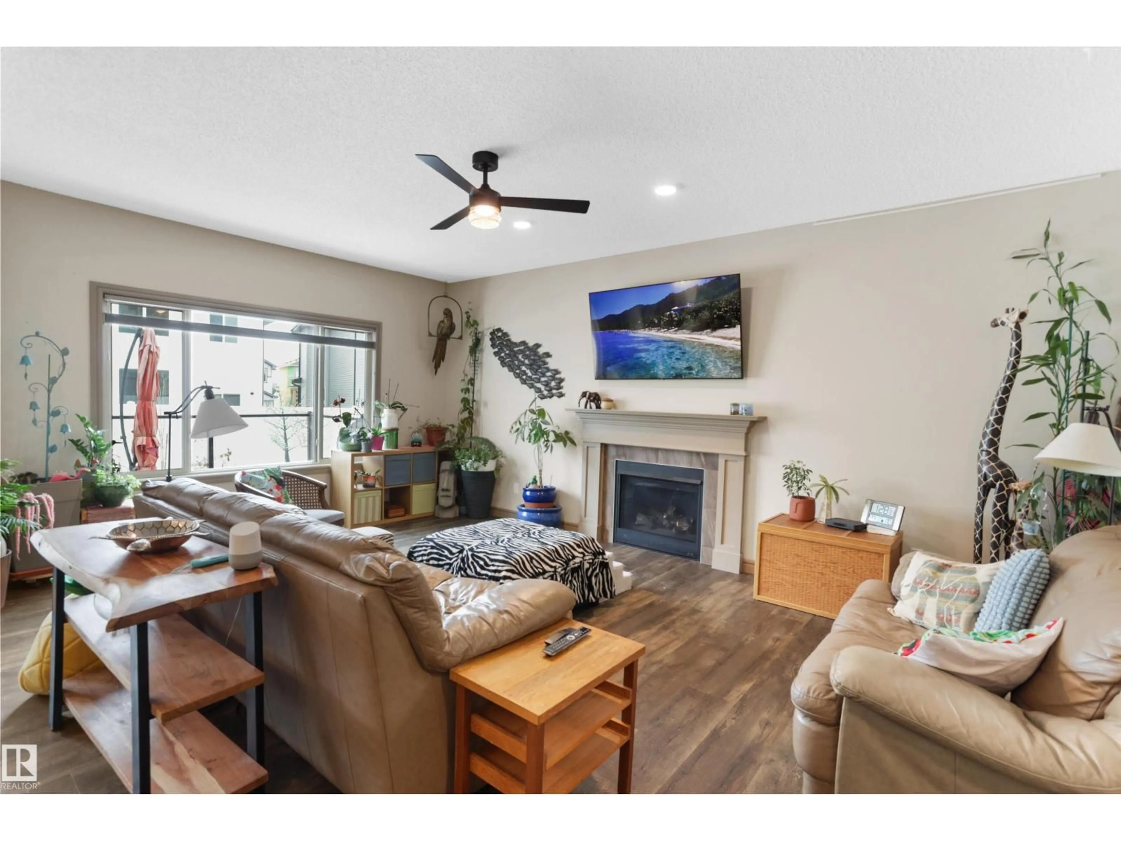 Living room with furniture, wood/laminate floor for 97 ASTORIA PT, Devon Alberta T9G0M3