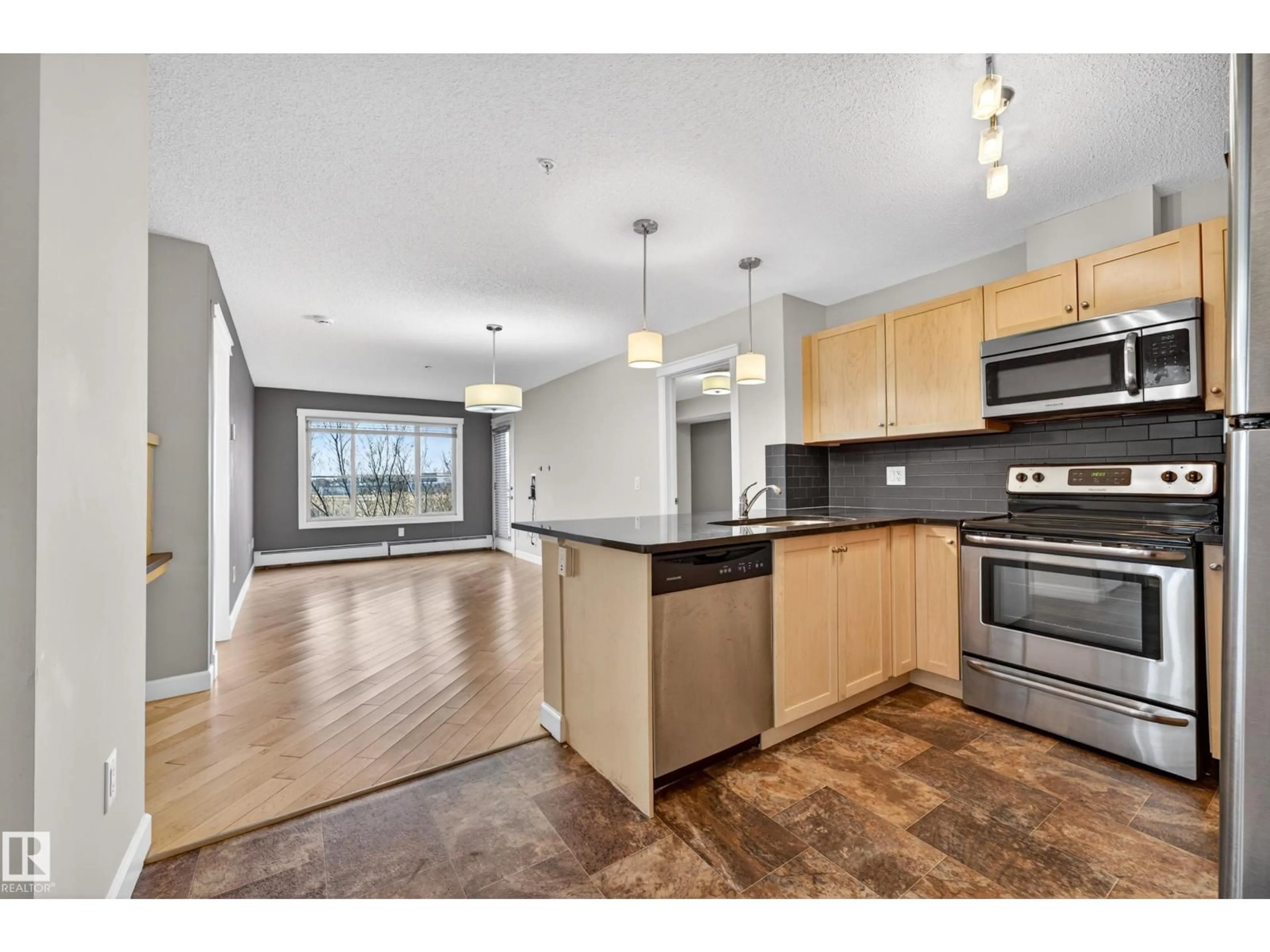 Open concept kitchen, unknown for #310 - 3719 WHITELAW LN, Edmonton Alberta T6W2C3