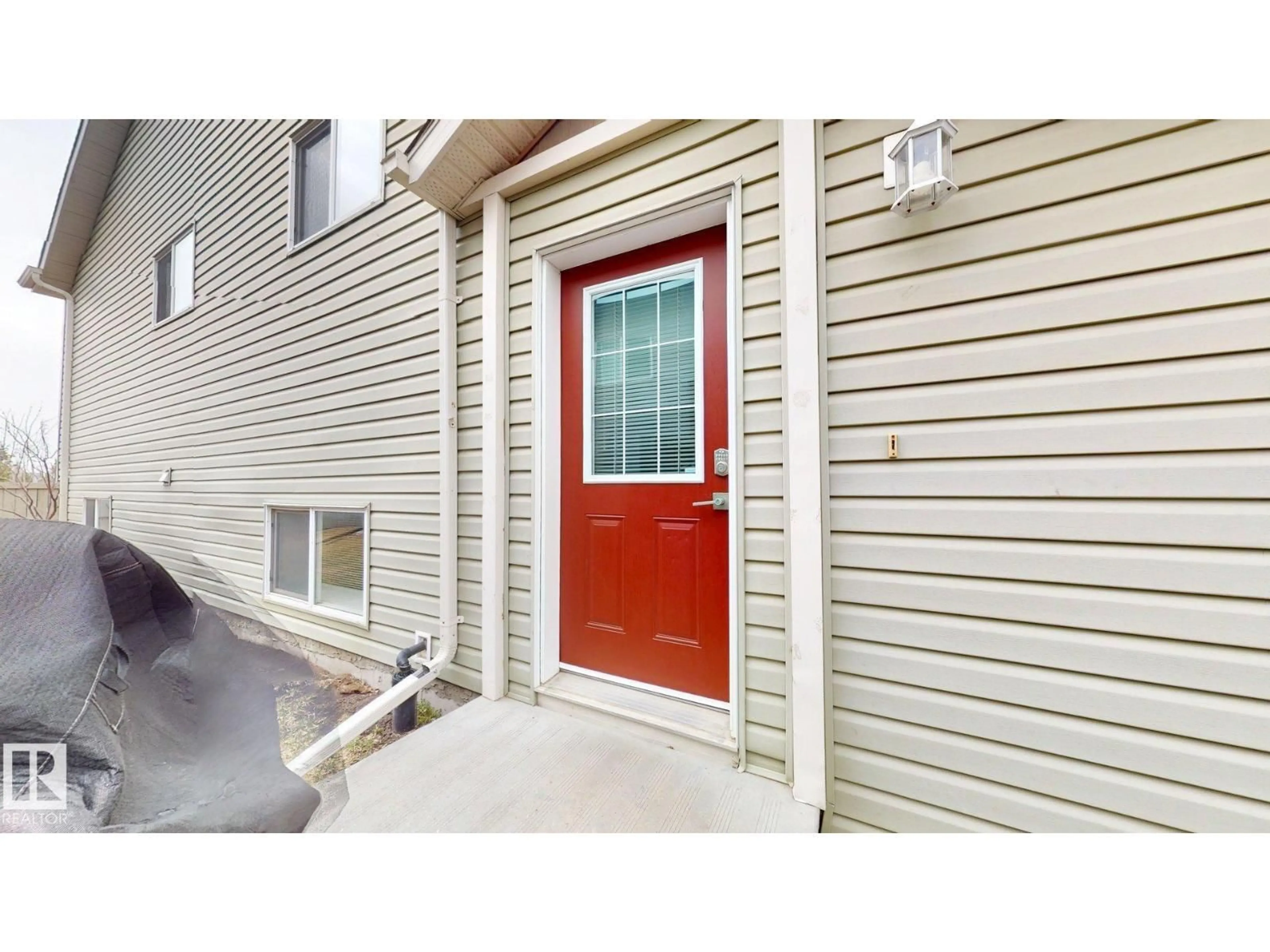 Home with vinyl exterior material, street for #2 - 6520 2 AV, Edmonton Alberta T6X1S4