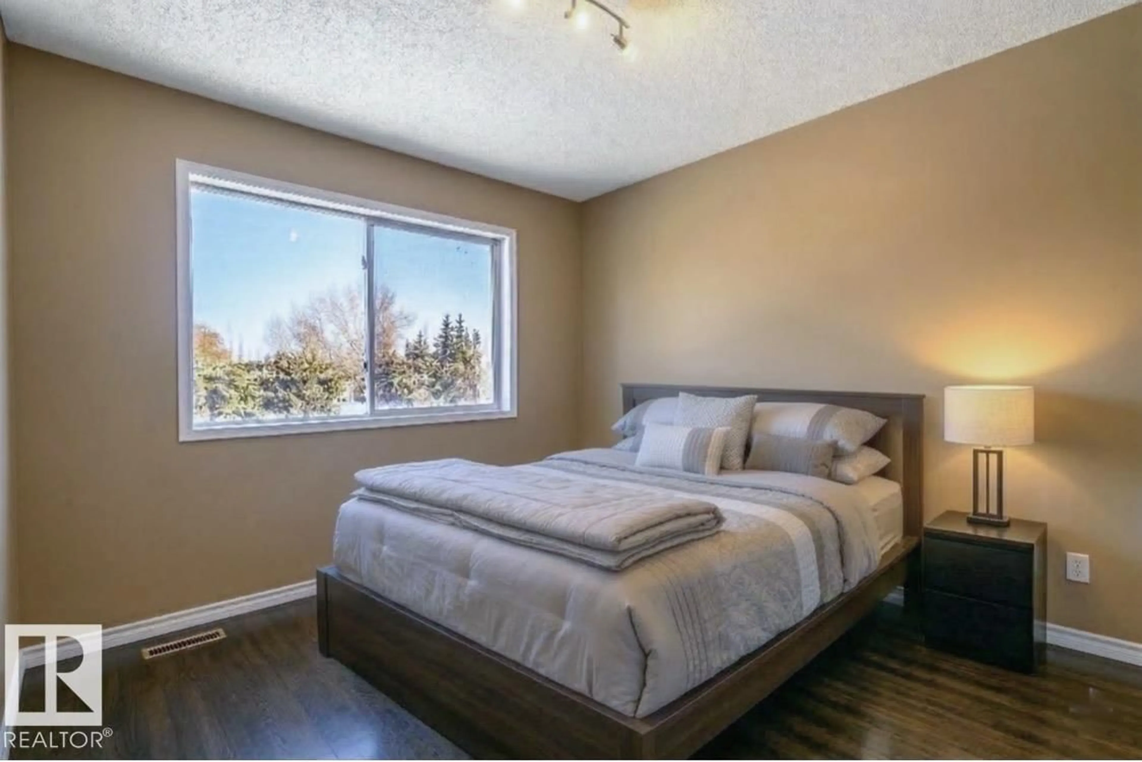 Bedroom with bed, wood/laminate floor for 18633 122 AV NW, Edmonton Alberta T5V1R4