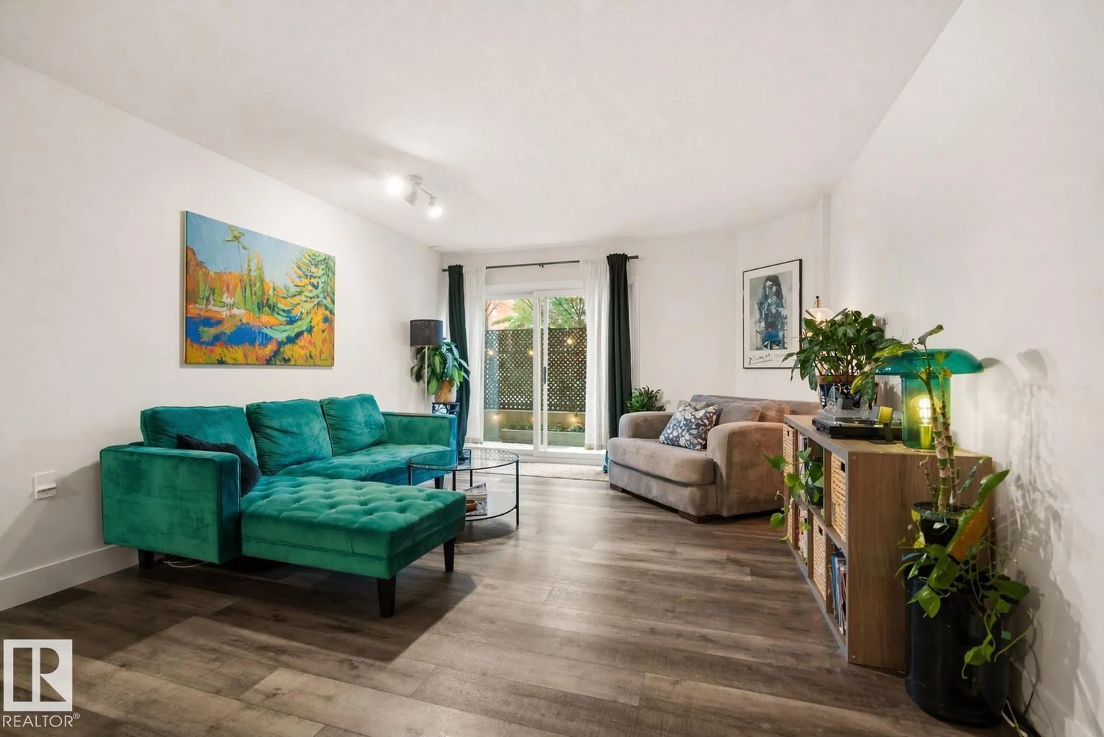 Living room with furniture, wood/laminate floor for #103 - 9715 110 ST, Edmonton Alberta T5K2M1