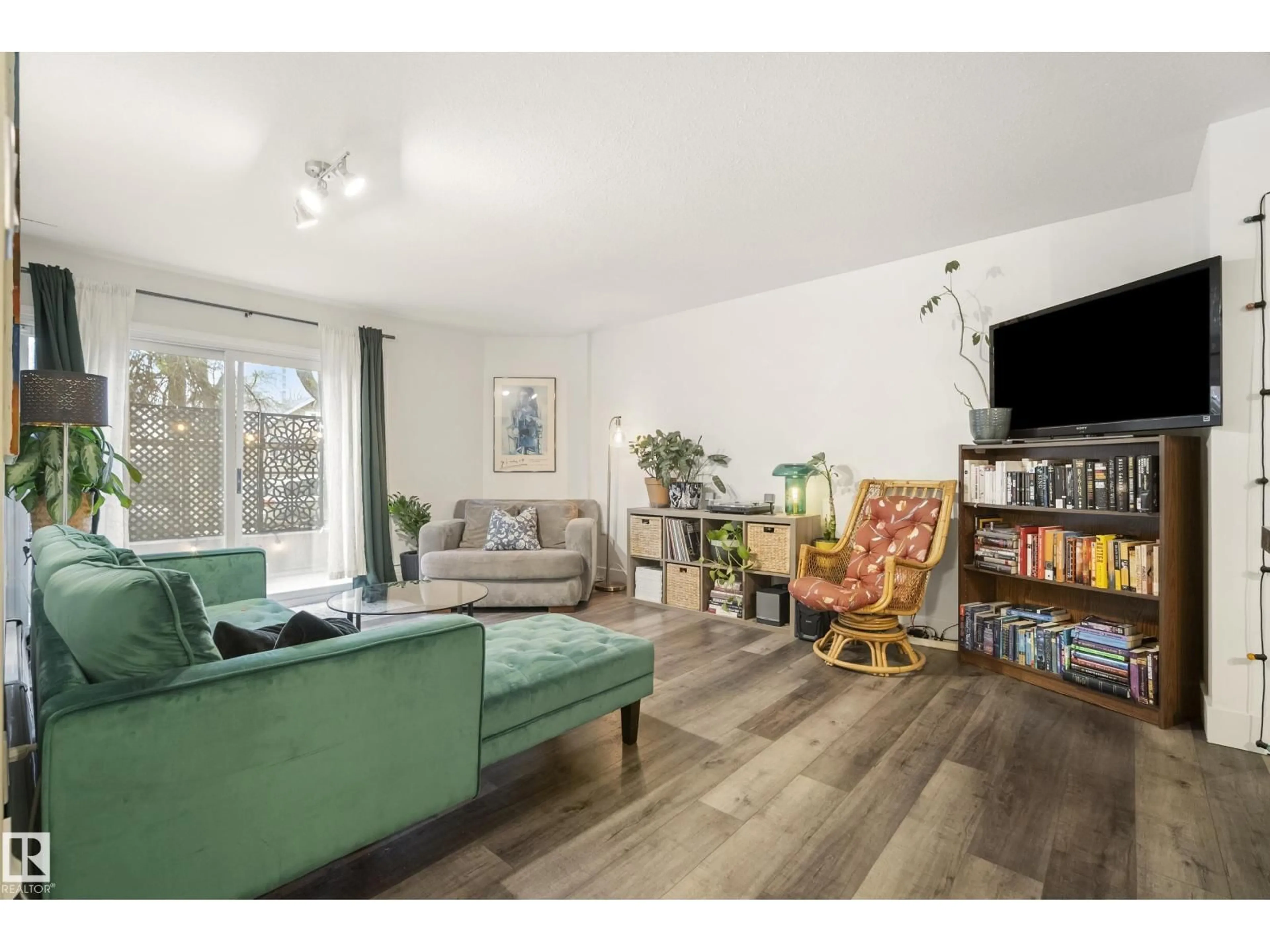 Living room with furniture, wood/laminate floor for #103 - 9715 110 ST, Edmonton Alberta T5K2M1