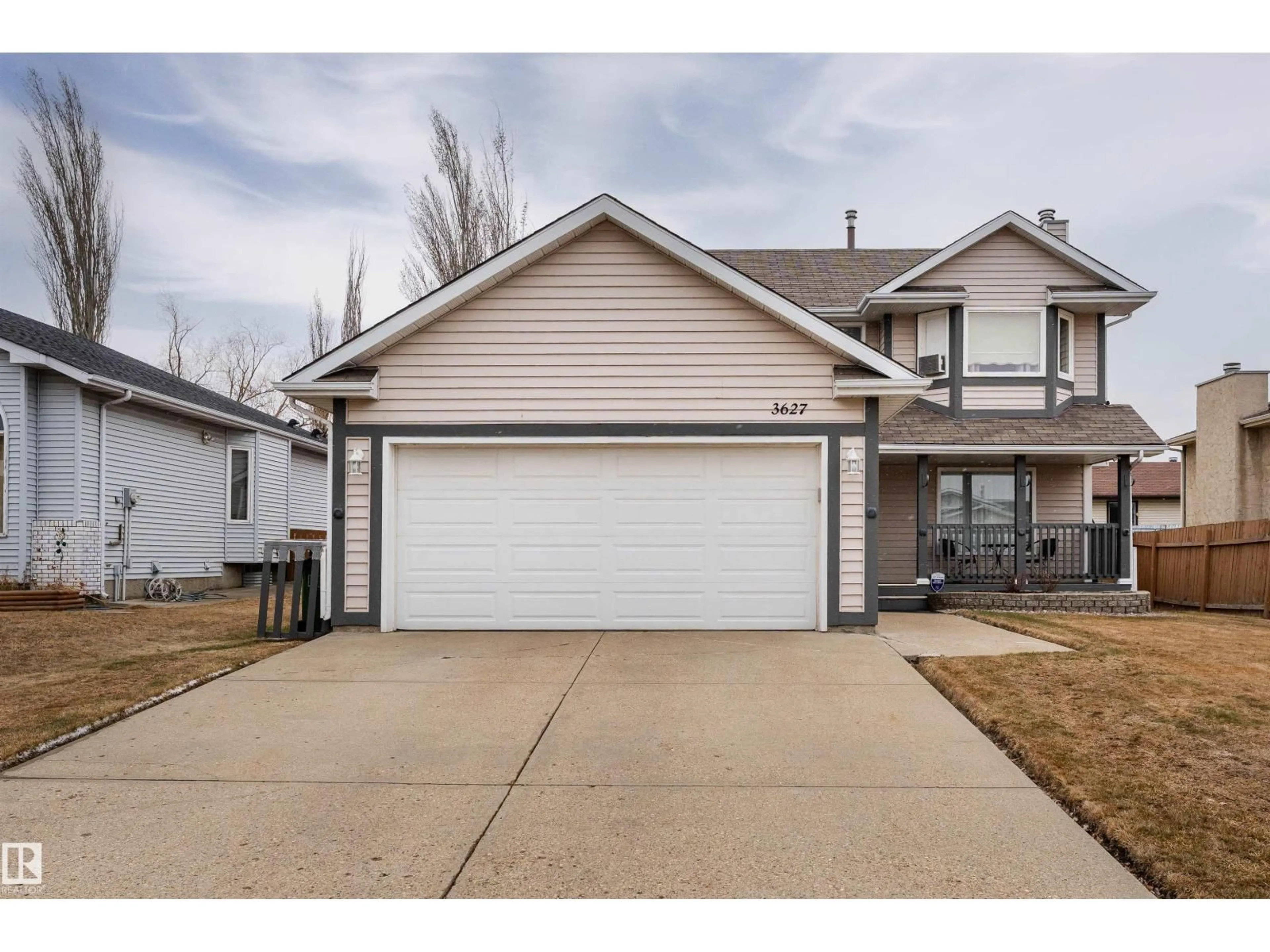 Home with vinyl exterior material, street for 3627 146 AV, Edmonton Alberta T5Y2J6