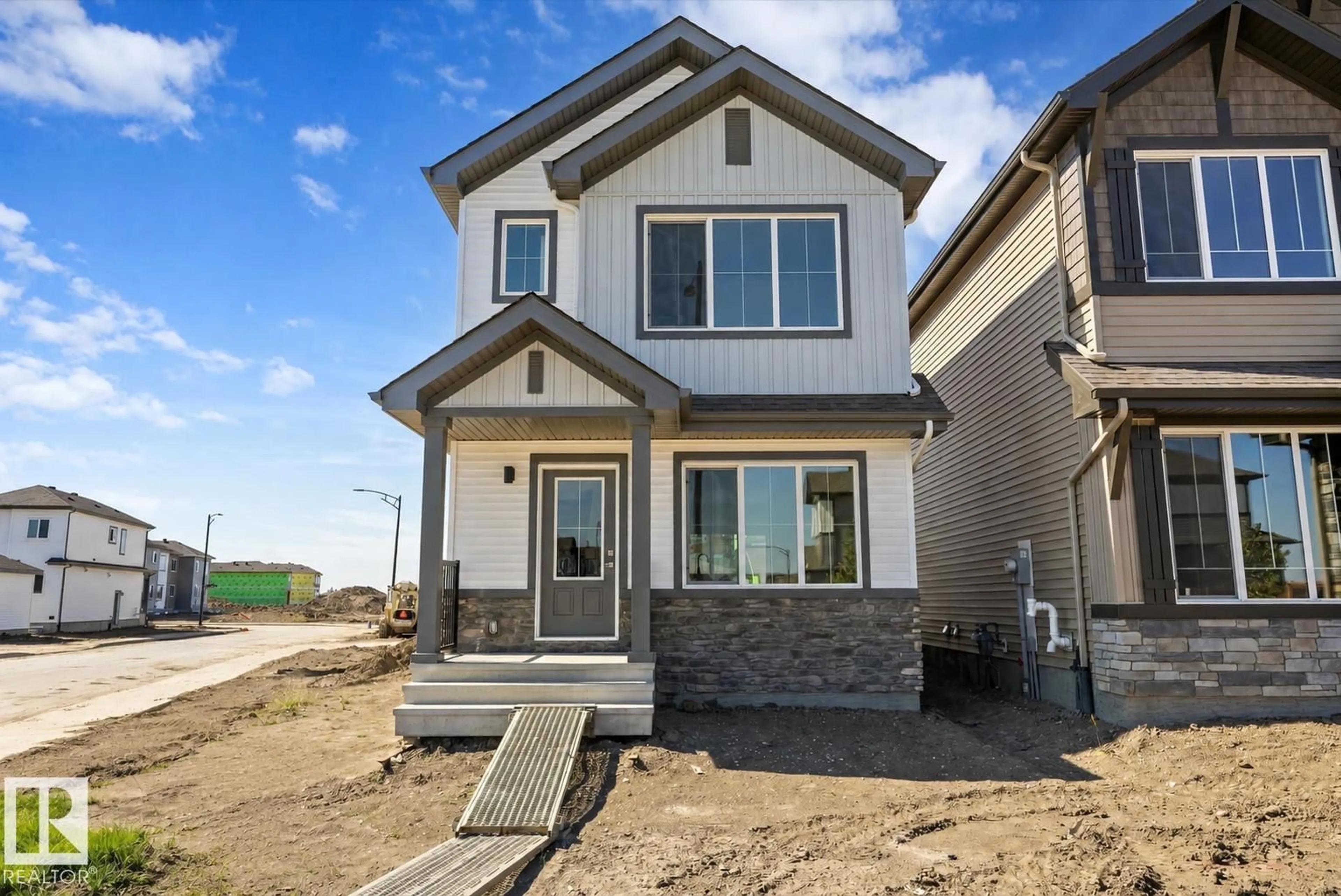 Home with vinyl exterior material, street for NW - 1605 210A ST, Edmonton Alberta T6M3E1
