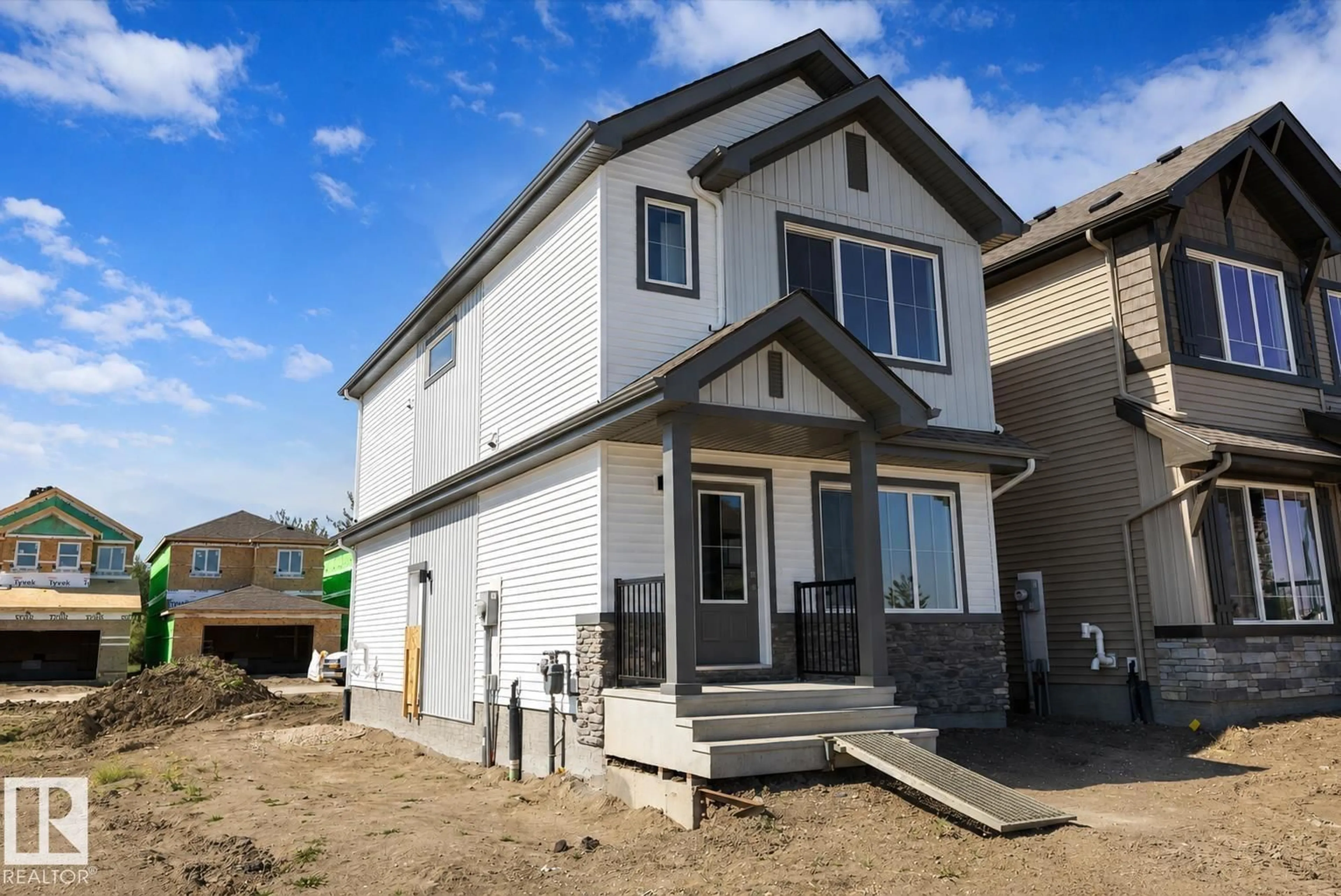 Home with vinyl exterior material, street for NW - 1605 210A ST, Edmonton Alberta T6M3E1