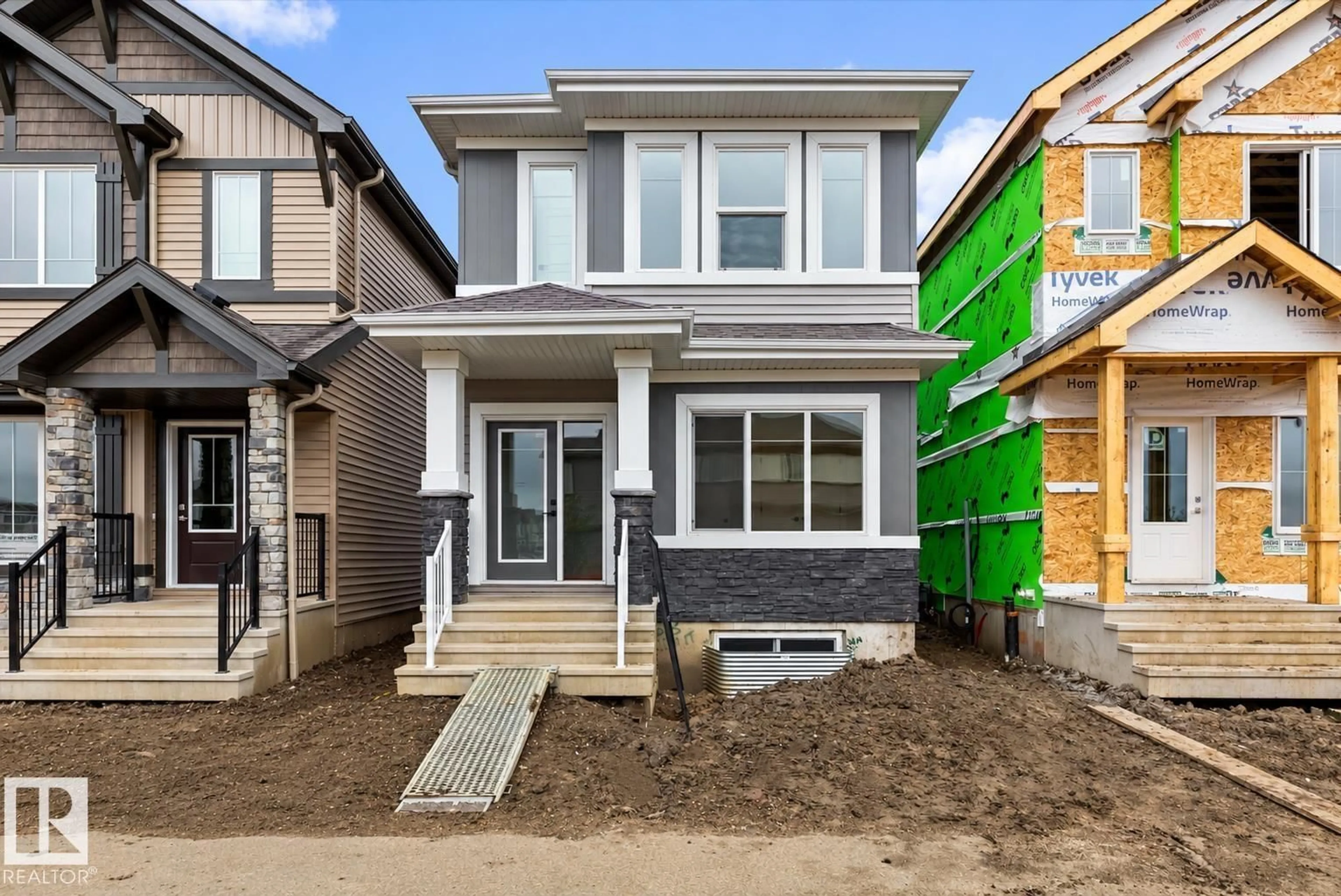 Home with brick exterior material, street for NW - 1613 210A ST, Edmonton Alberta T6M3E1