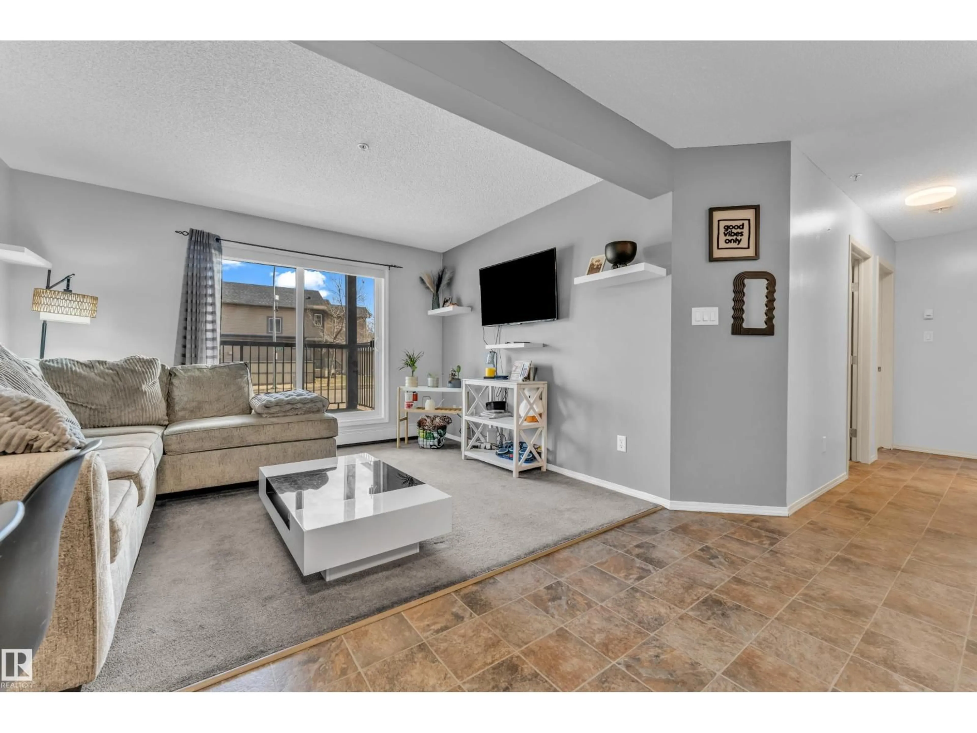 Living room with furniture, unknown for 113 - 5951 165 AV, Edmonton Alberta T5Y0J6