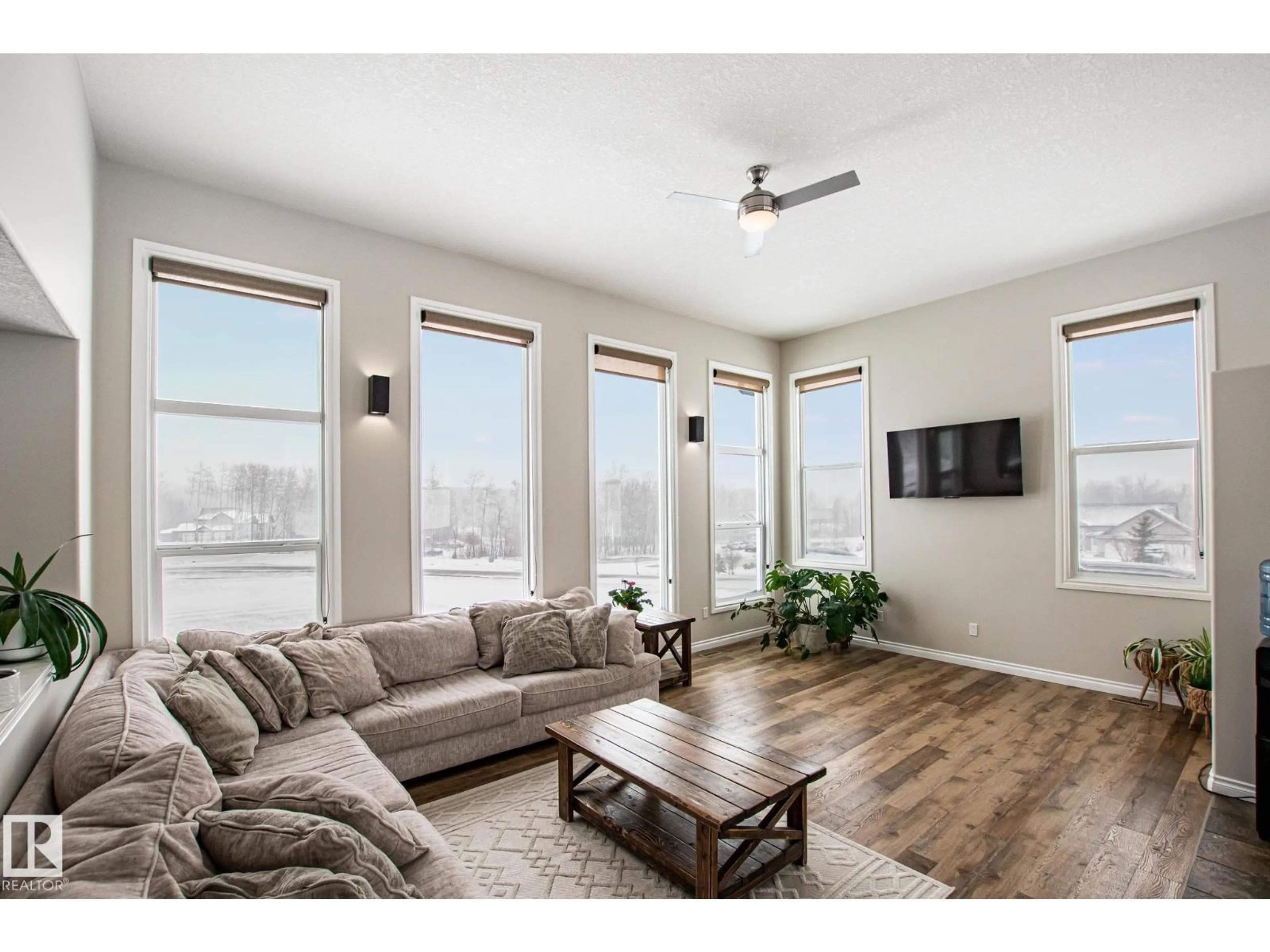 Living room with furniture, wood/laminate floor for 61119 - 24 RGE RD 465, Rural Bonnyville M.D. Alberta T9N2J6