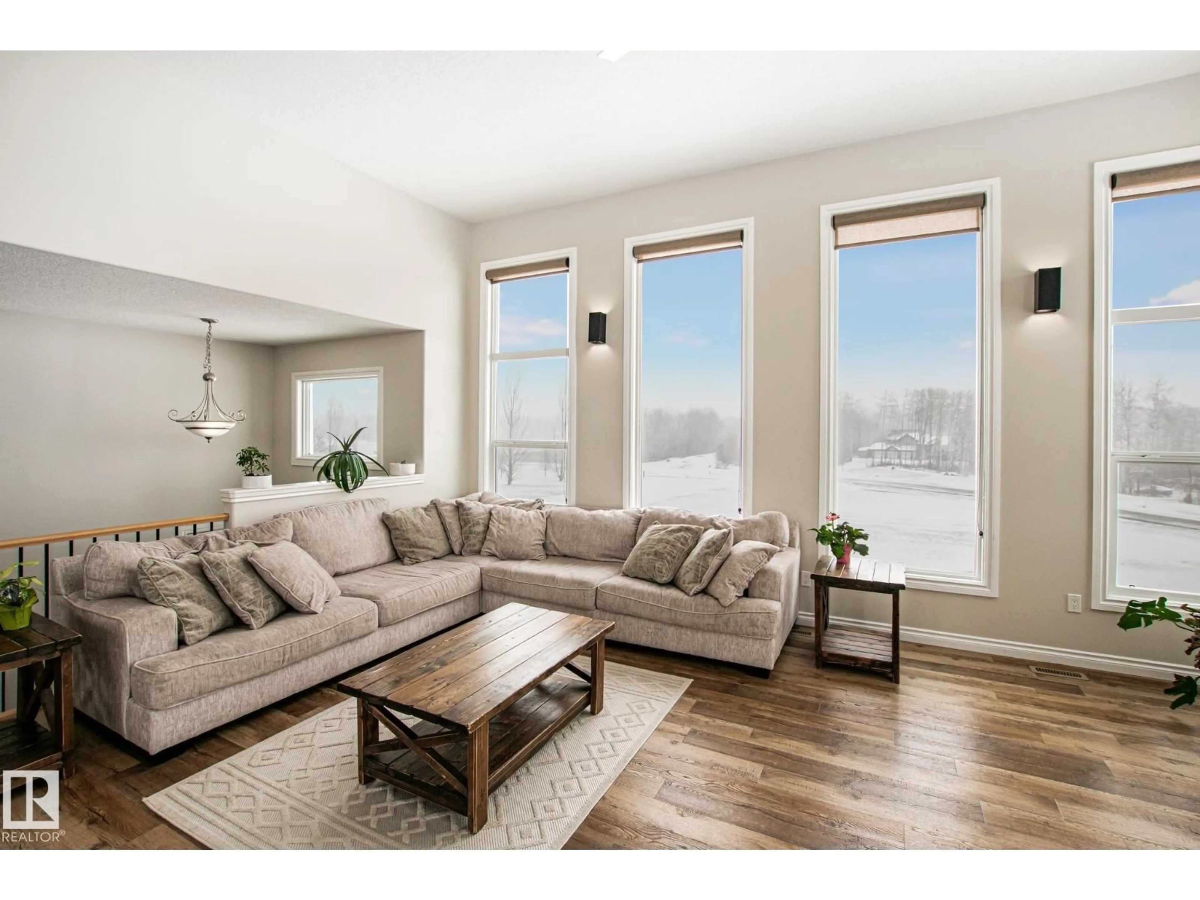 Living room with furniture, wood/laminate floor for 61119 - 24 RGE RD 465, Rural Bonnyville M.D. Alberta T9N2J6