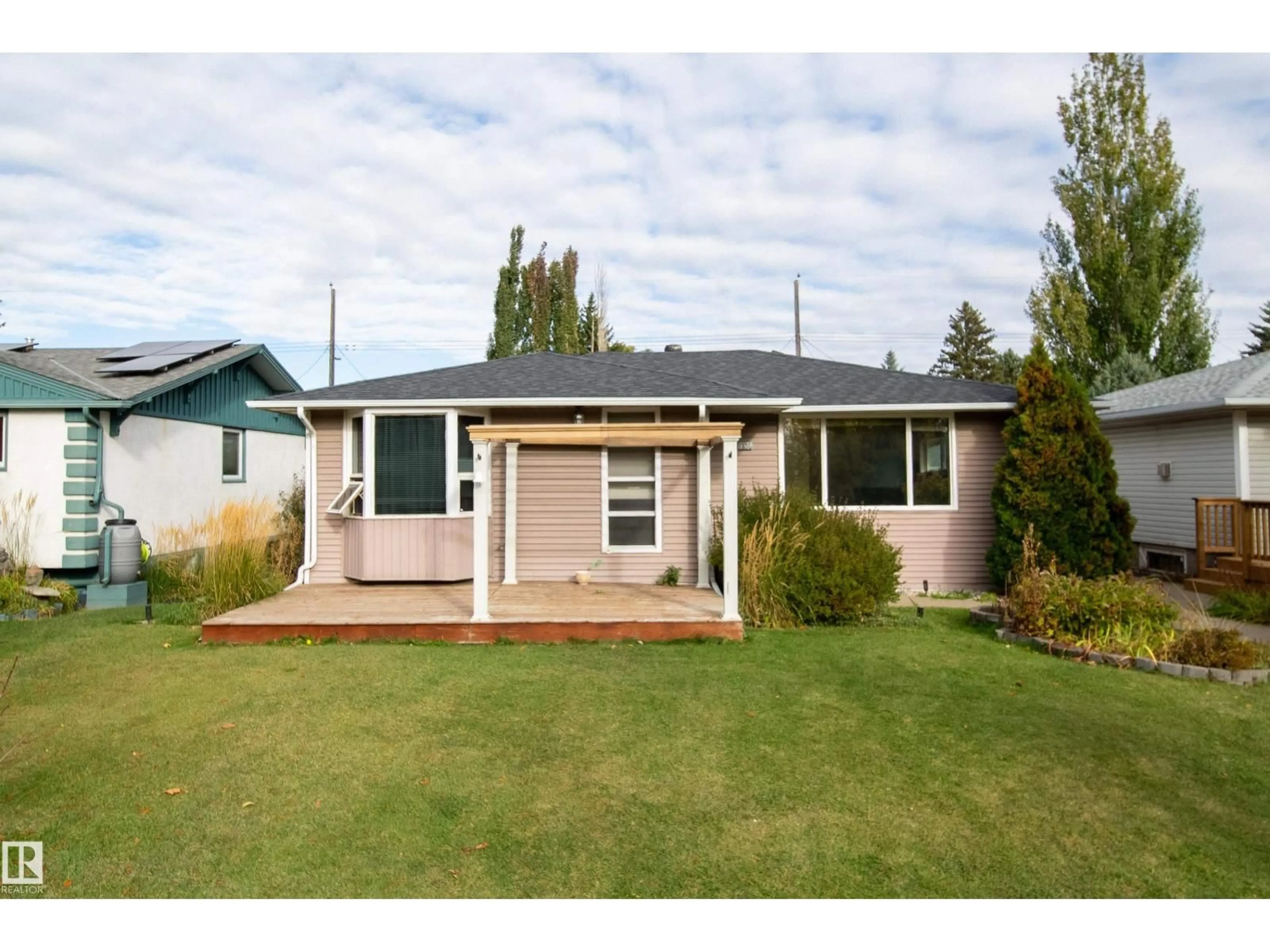 Home with vinyl exterior material, street for 7135 87 ST, Edmonton Alberta T6G3G1