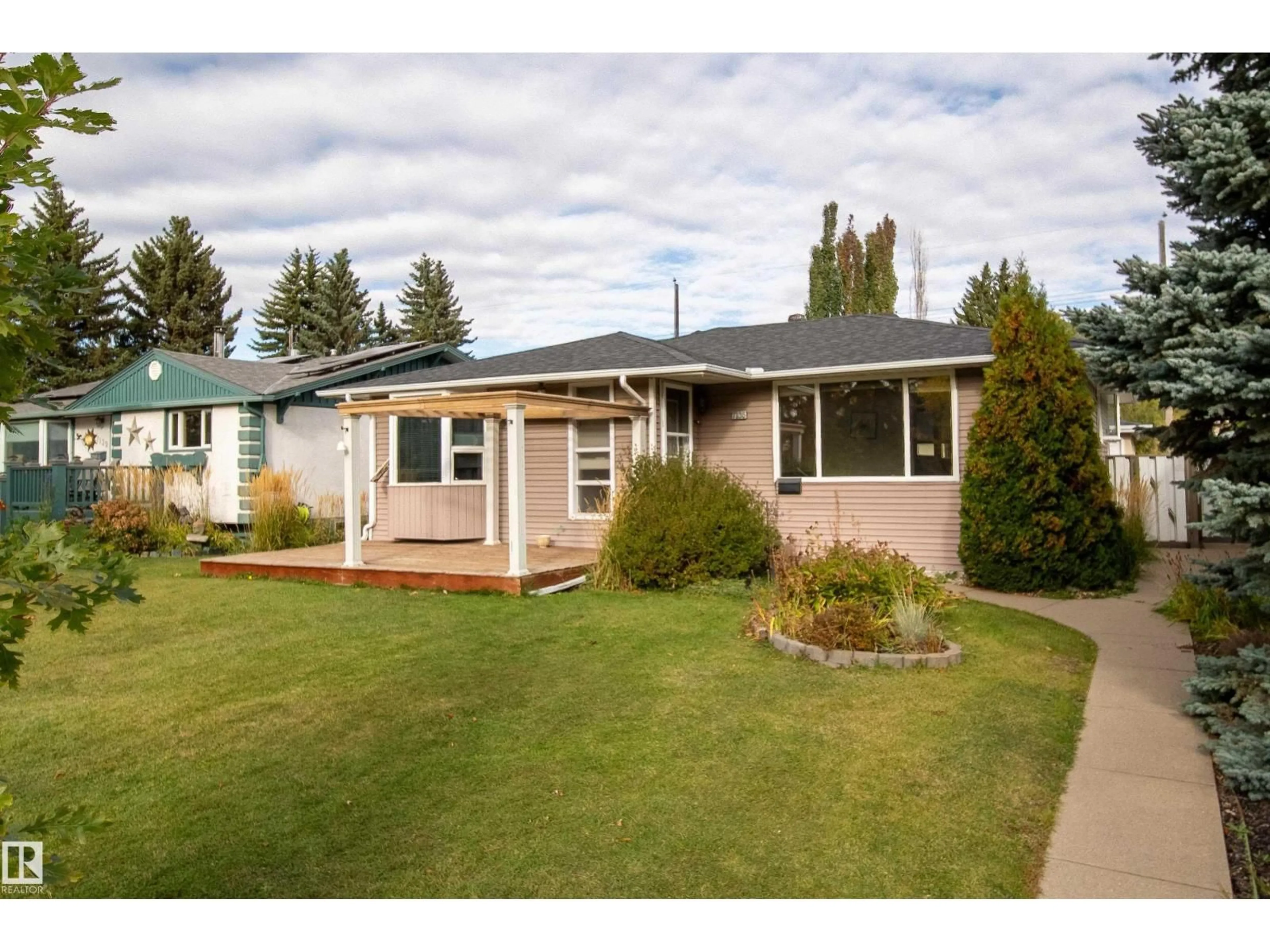 Home with vinyl exterior material, street for 7135 87 ST, Edmonton Alberta T6G3G1