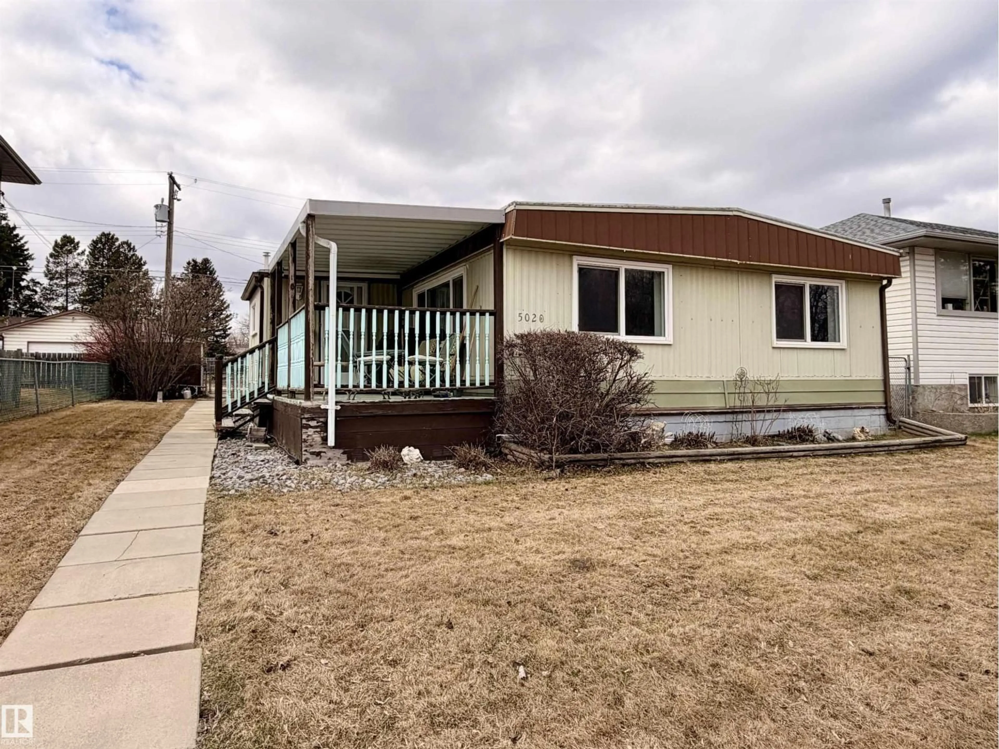Home with vinyl exterior material, street for 5020 43 ST, Drayton Valley Alberta T7A1B8