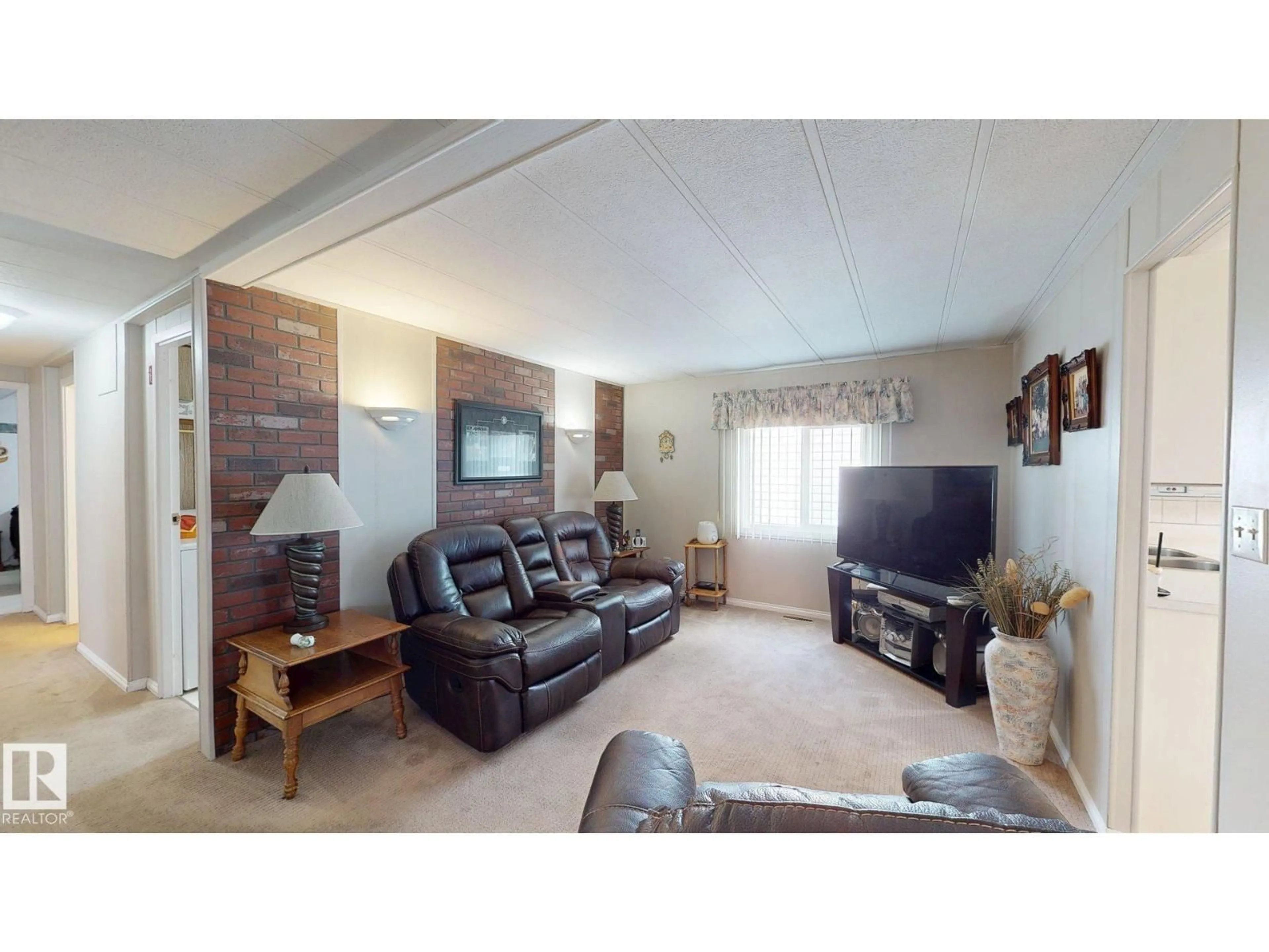 Living room with furniture, wood/laminate floor for 5020 43 ST, Drayton Valley Alberta T7A1B8