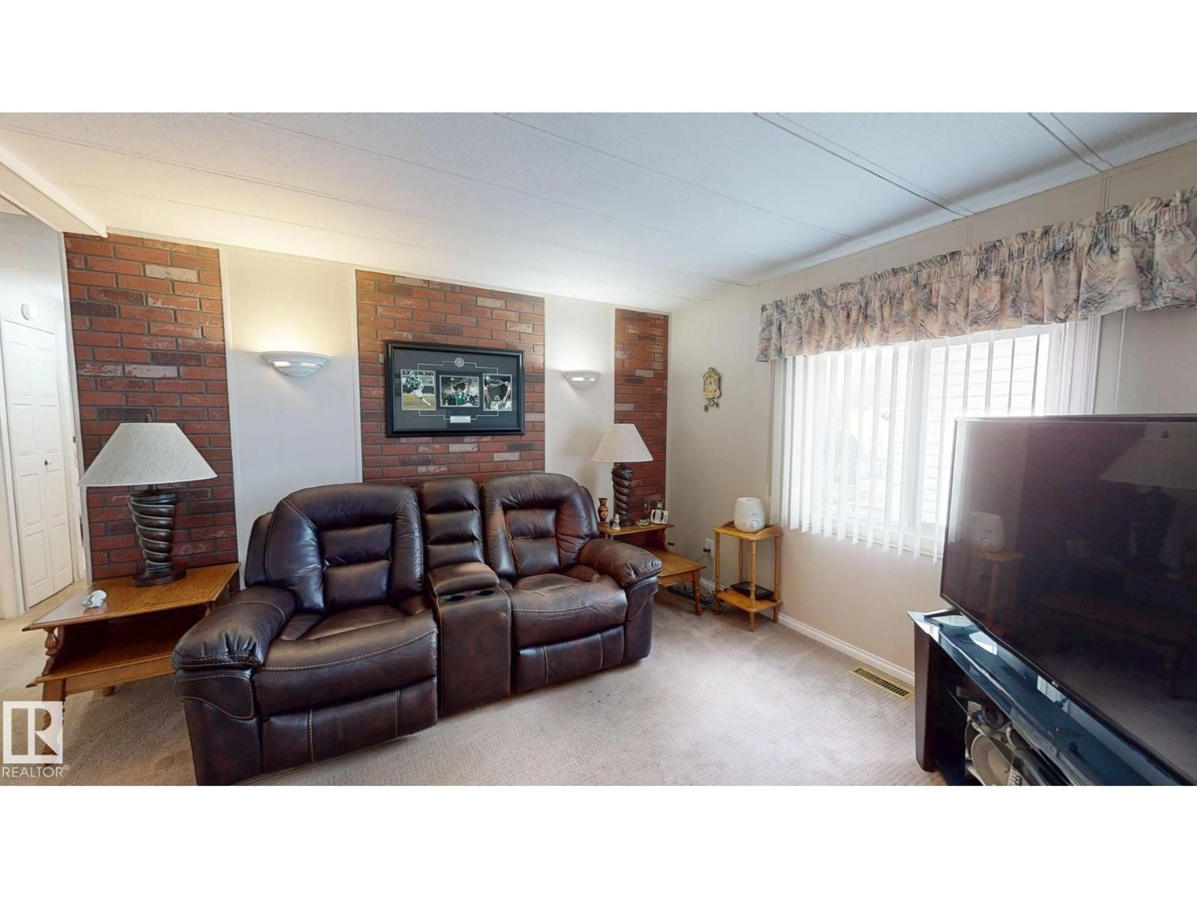 Living room with furniture, wood/laminate floor for 5020 43 ST, Drayton Valley Alberta T7A1B8