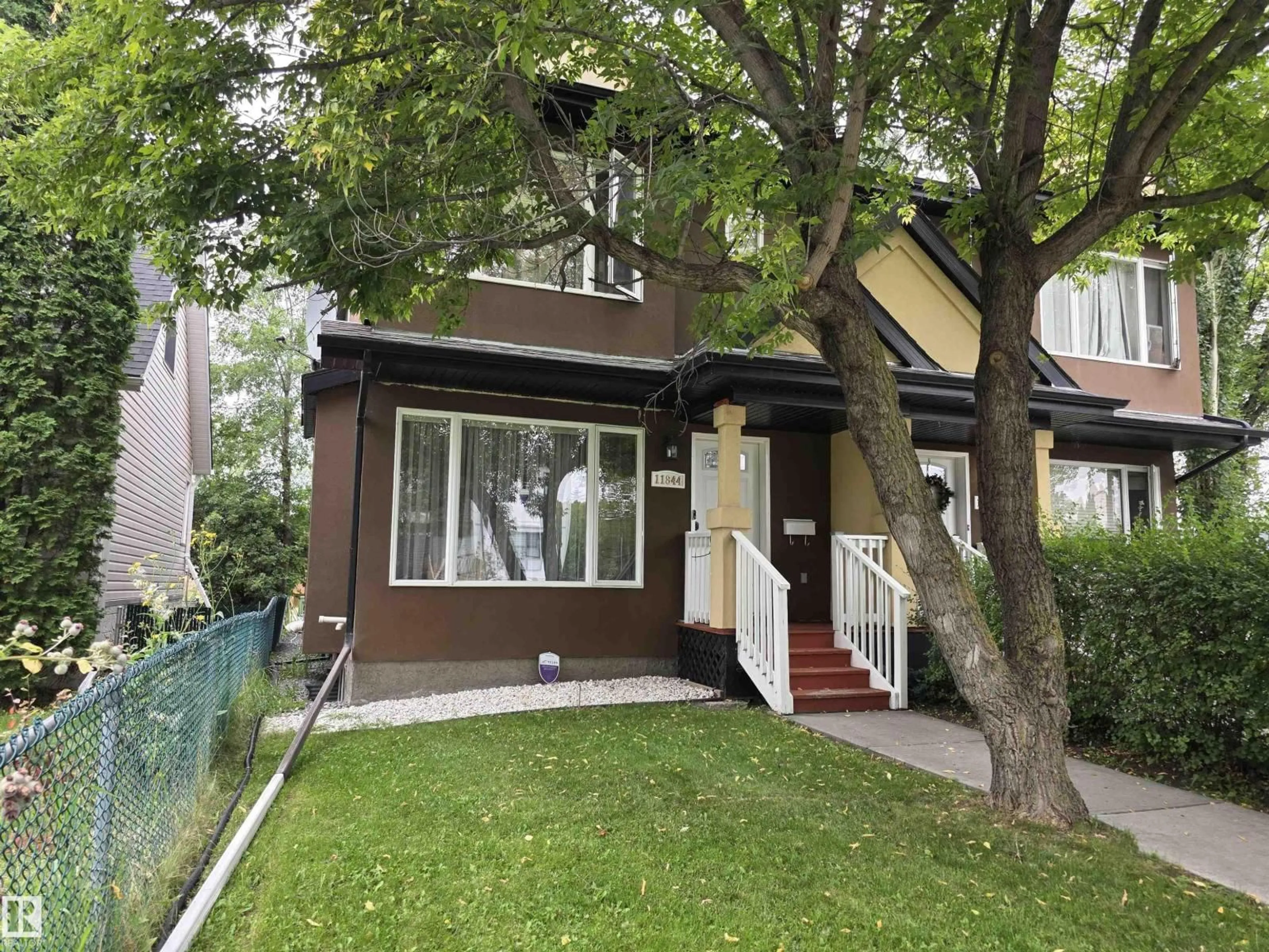 Home with vinyl exterior material, street for NW - 11844 125 ST, Edmonton Alberta T5L0R9