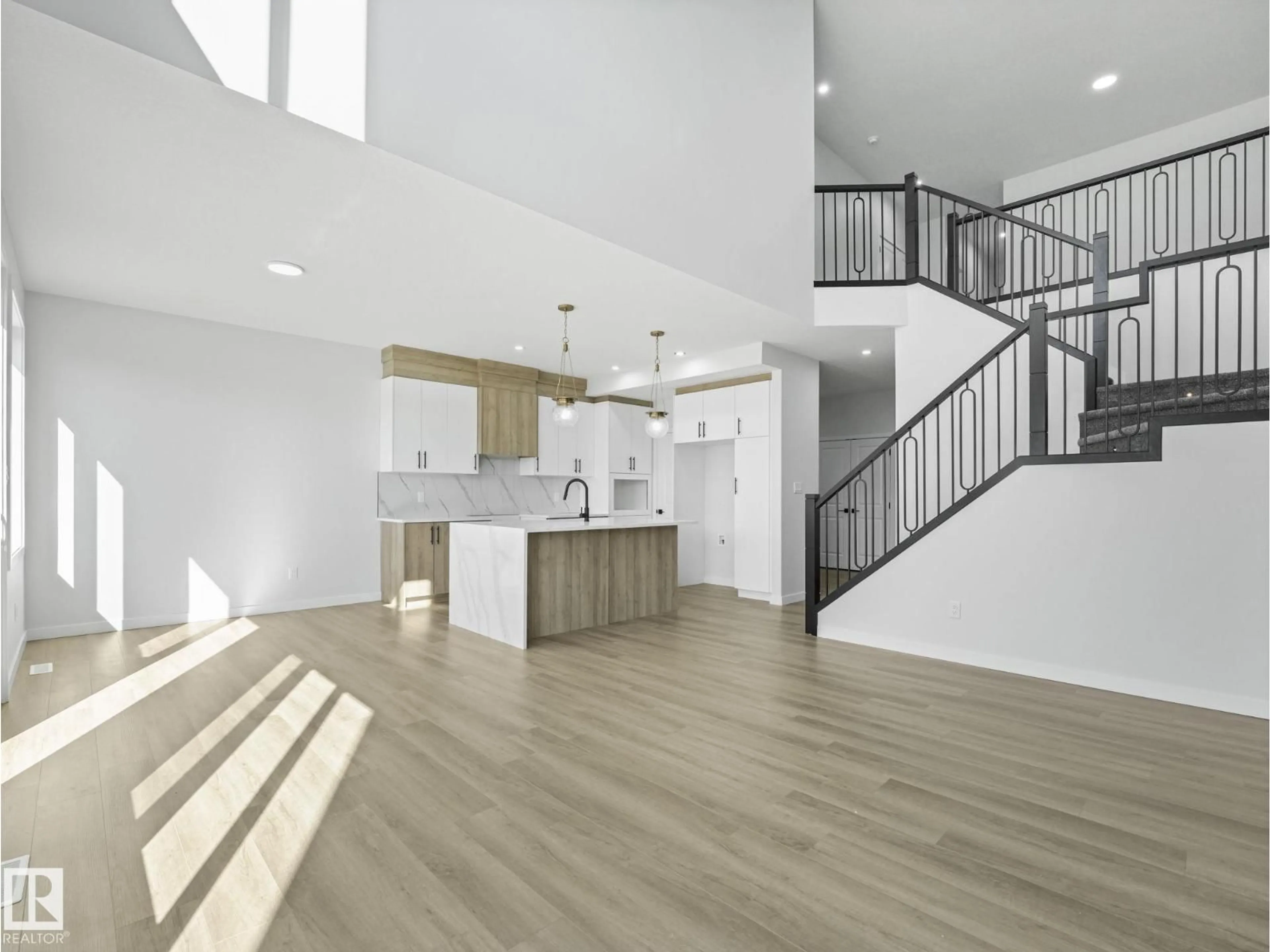 Open concept kitchen, wood/laminate floor for 274 MUNN WY, Leduc Alberta T9E1V1