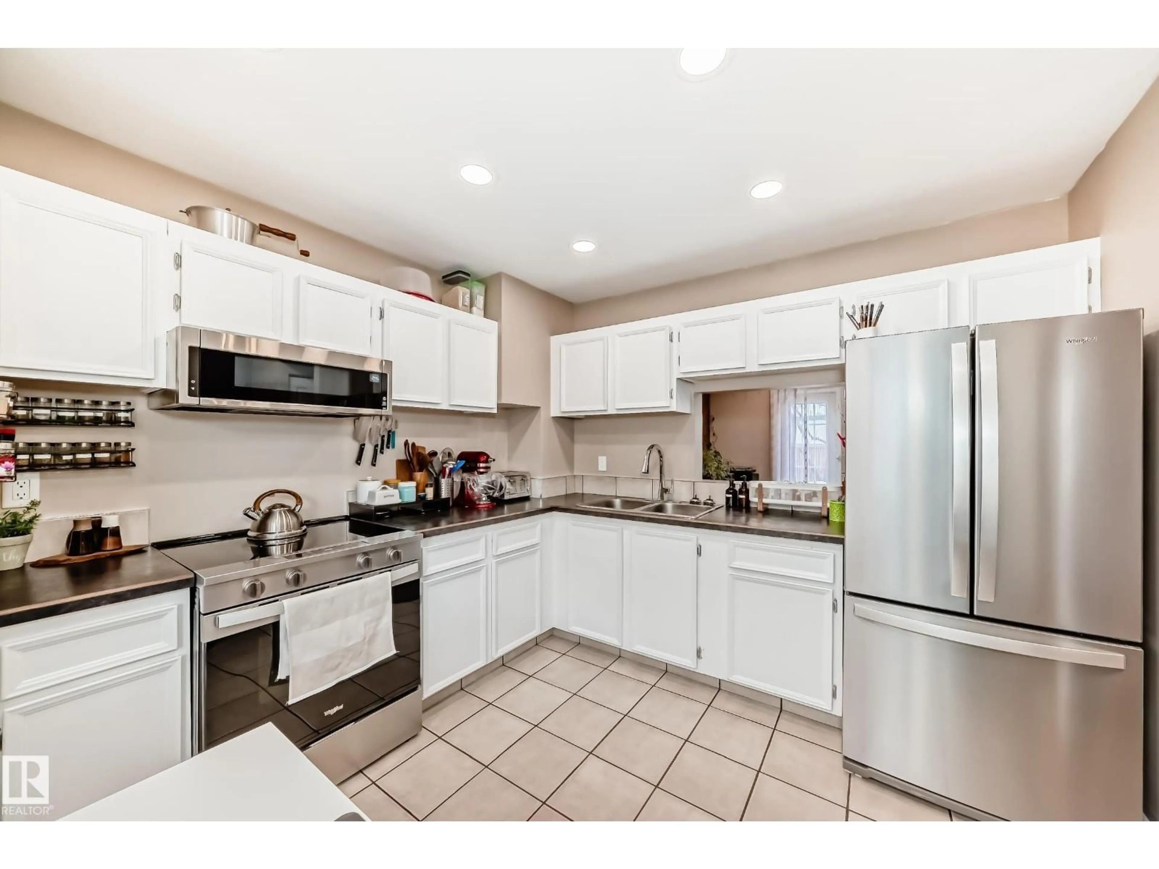 Open concept kitchen, ceramic/tile floor for 3207 139 AV, Edmonton Alberta T5Y1T2