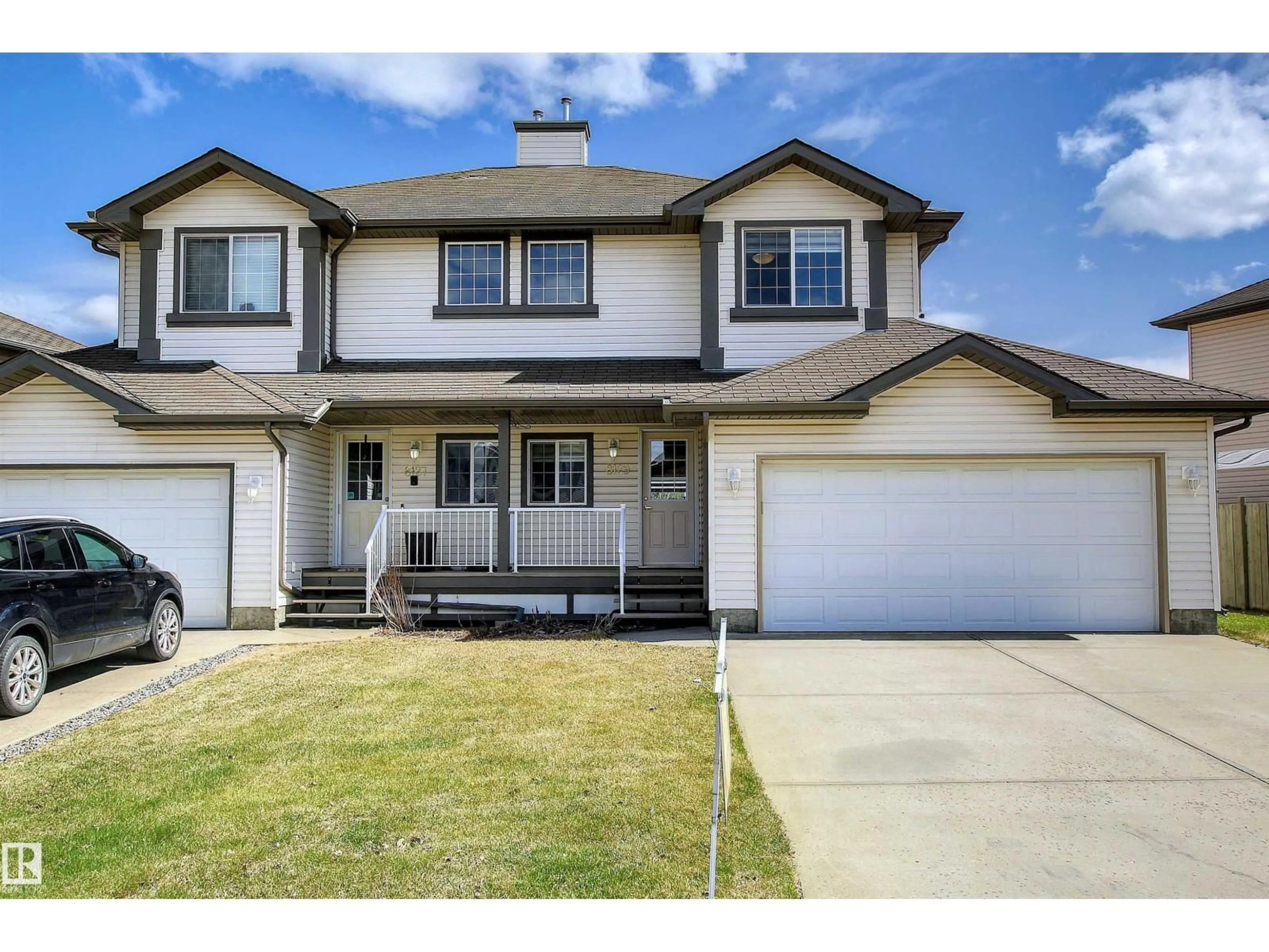 Home with vinyl exterior material, street for 8129 7 AV SW, Edmonton Alberta T6X1L9