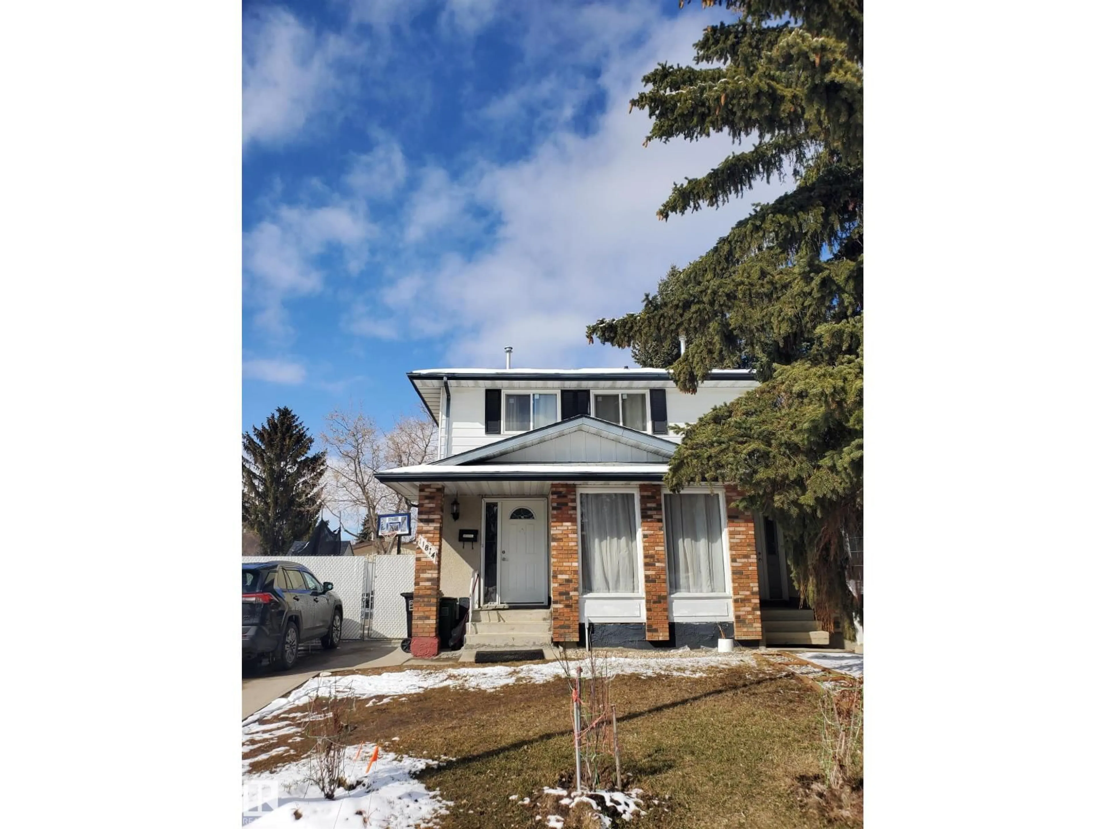 Home with vinyl exterior material, street for 11814 157 AV, Edmonton Alberta T5X2K2