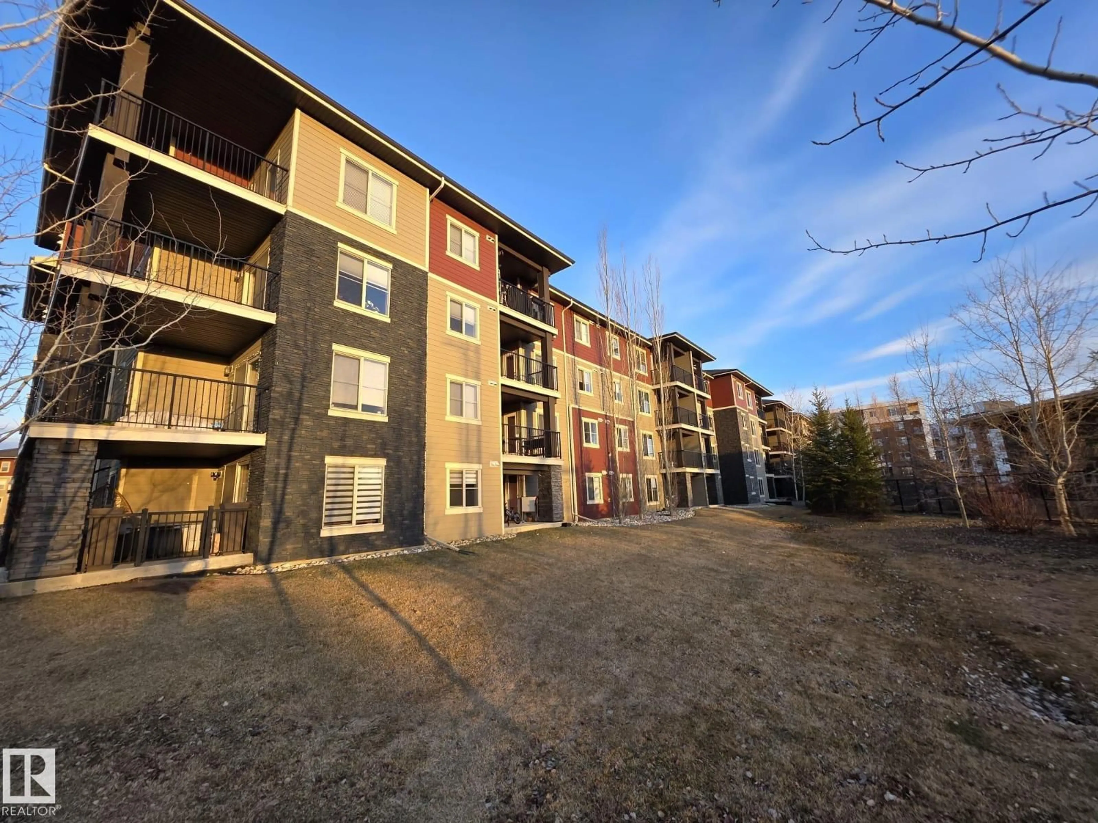A pic from outside/outdoor area/front of a property/back of a property/a pic from drone, building for #206 - 12045 22 AV SW, Edmonton Alberta T6W2Y2