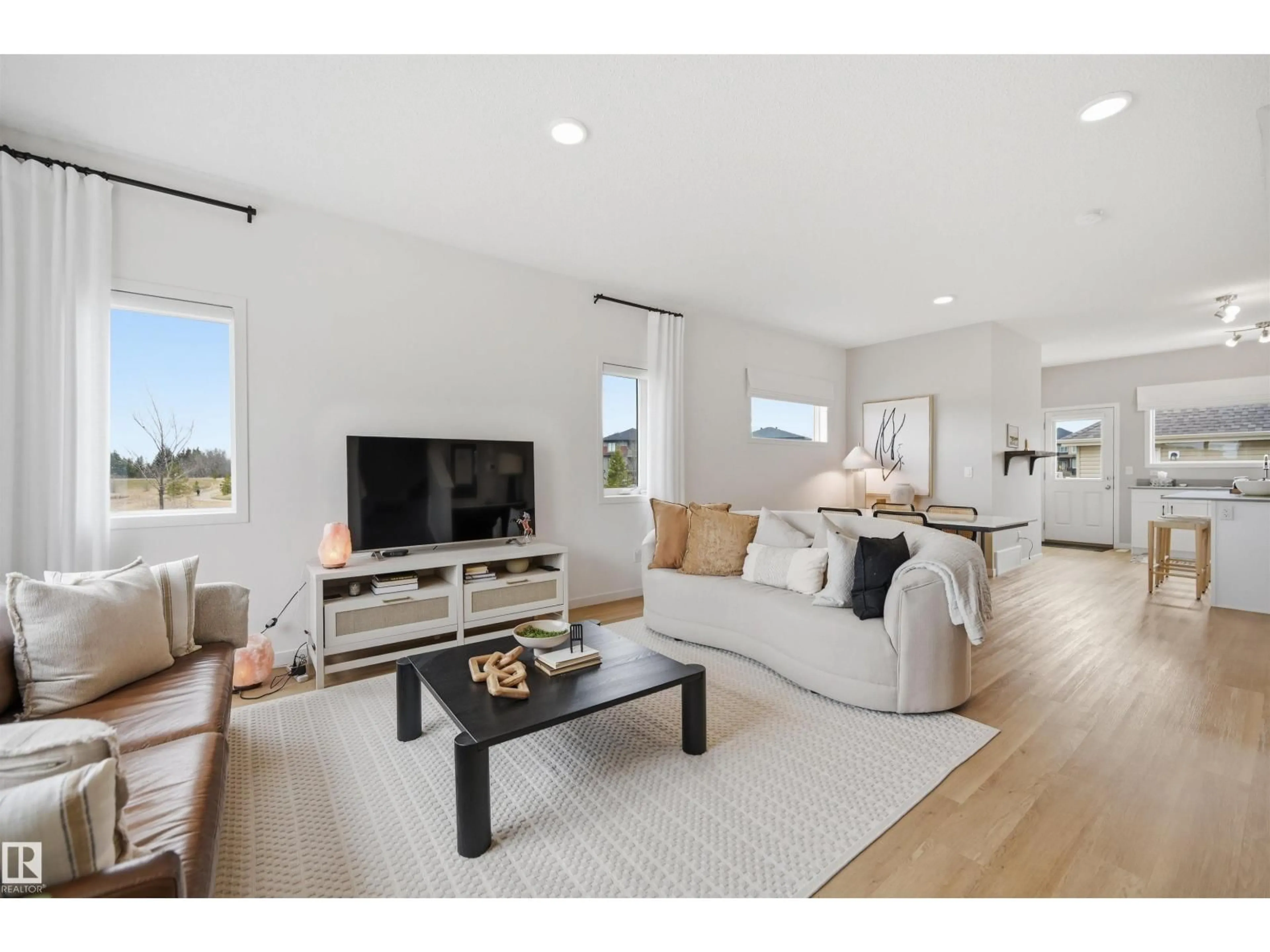 Living room with furniture, wood/laminate floor for 9496 COLAK LN, Edmonton Alberta T6W3Y8