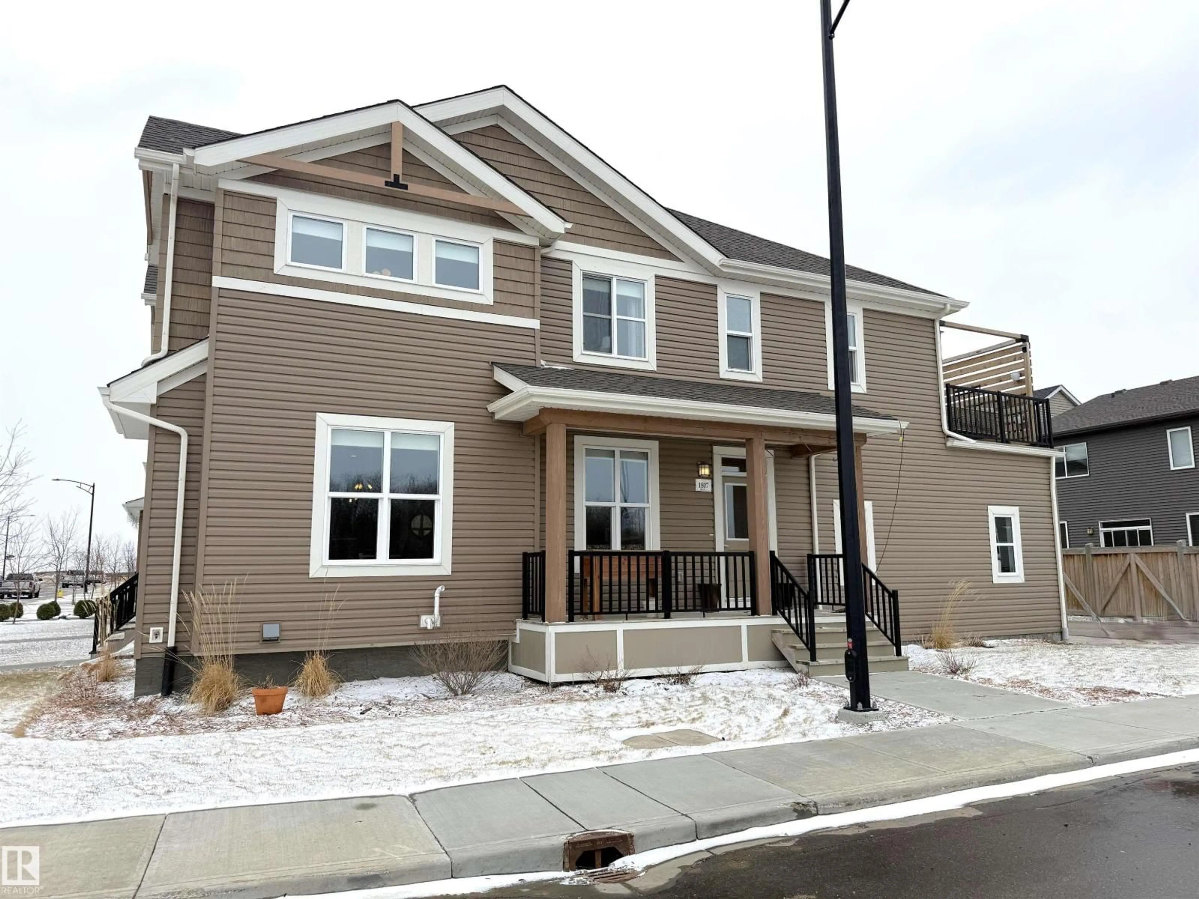 Home with brick exterior material, street for NW - 1807 202 ST, Edmonton Alberta T6M0X9
