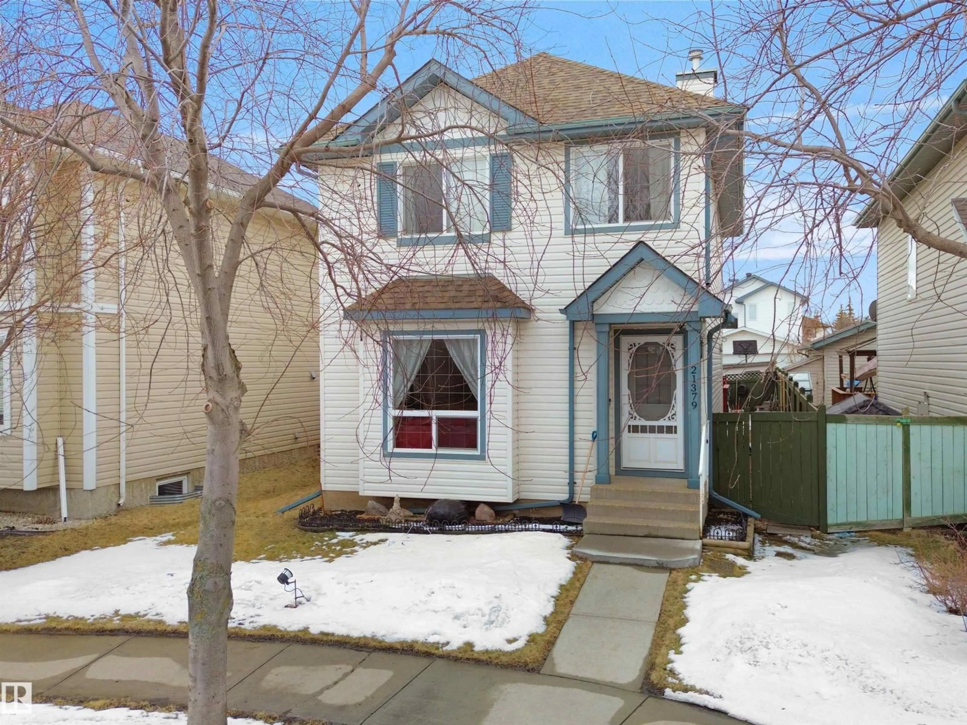 Home with vinyl exterior material, street for NW - 21379 89 AV, Edmonton Alberta T5T6V3