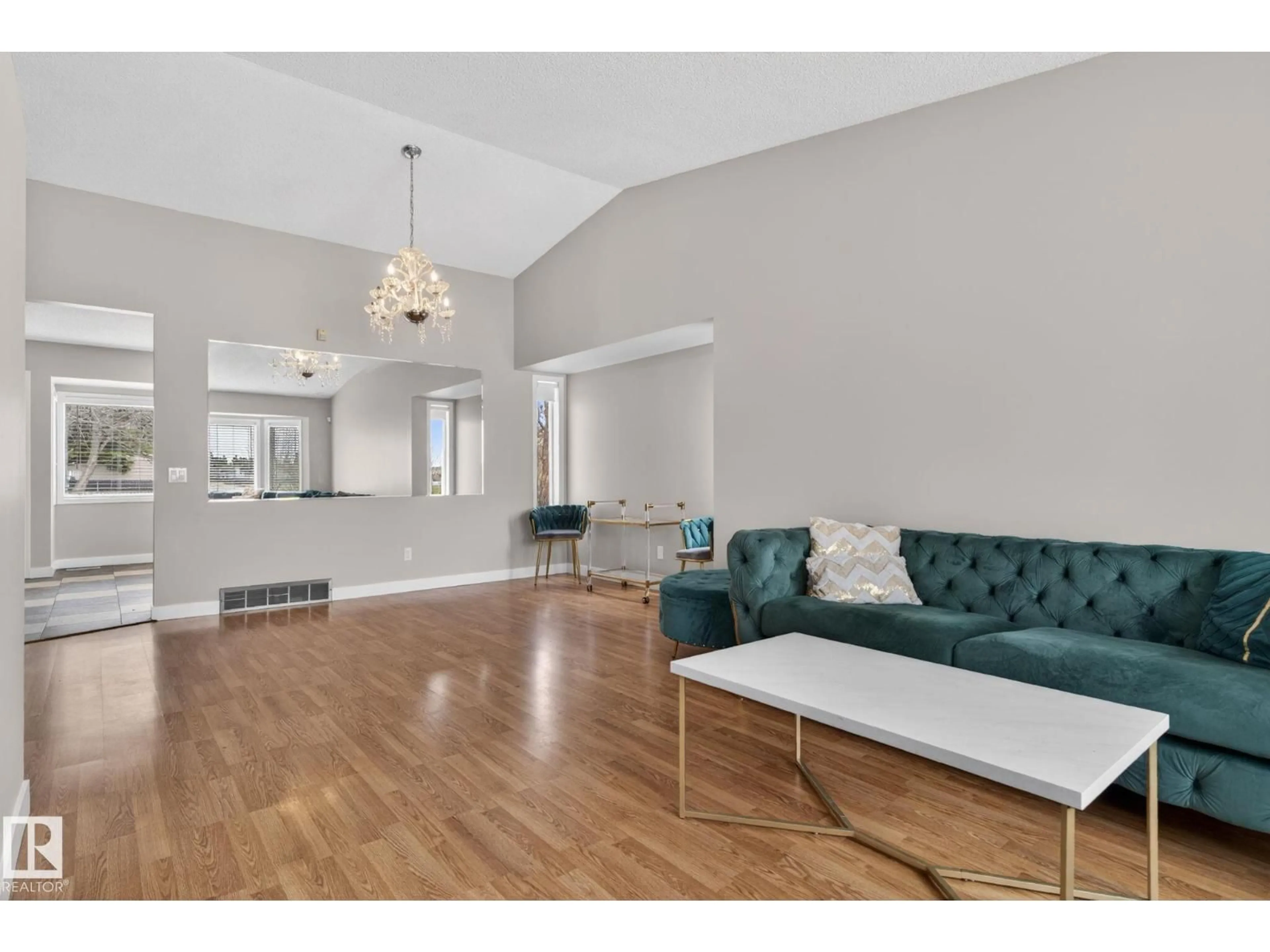 Living room with furniture, wood/laminate floor for 18604 97A AV, Edmonton Alberta T5T3J4