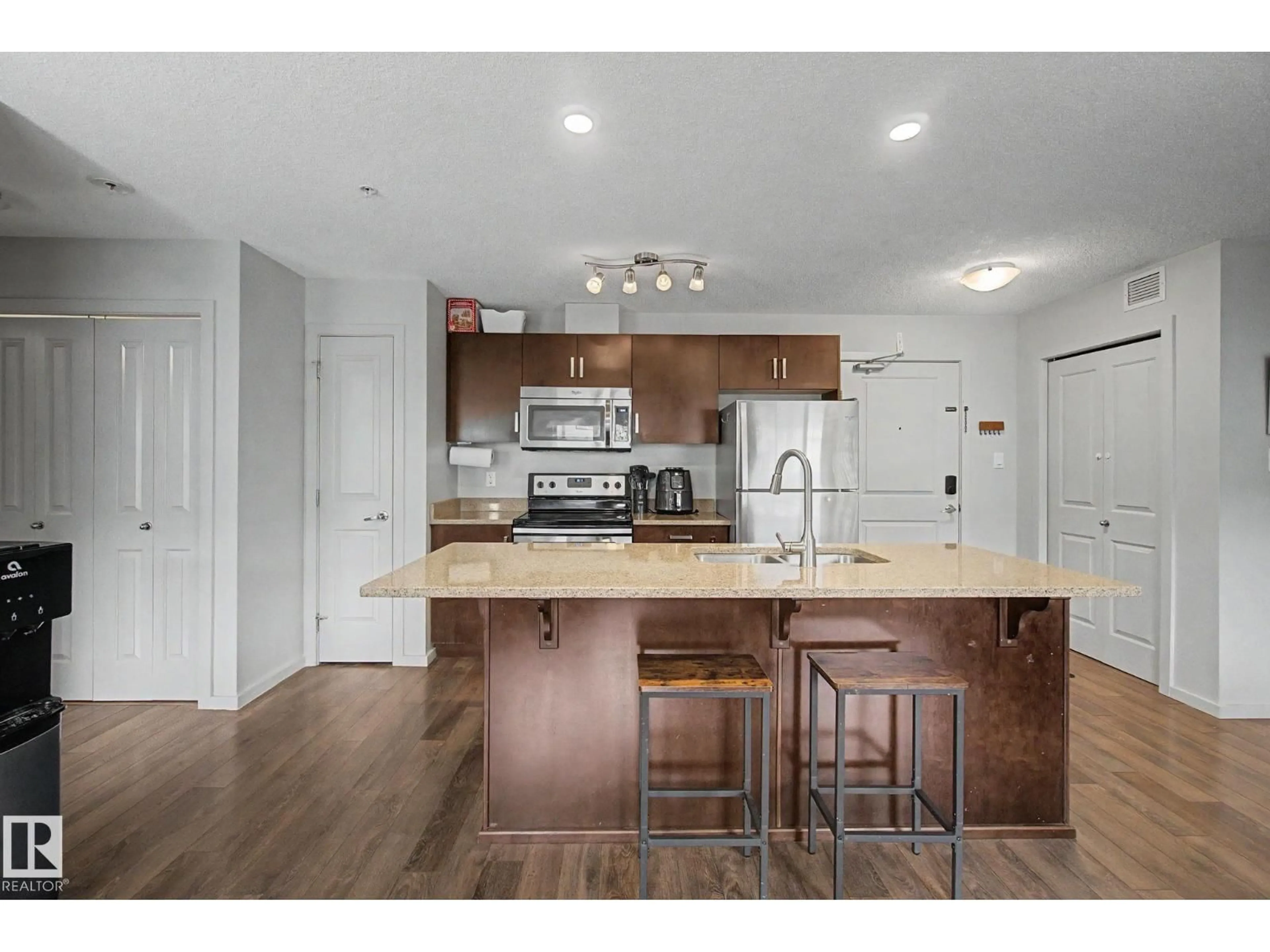 Open concept kitchen, wood/laminate floor for #330 - 390 WINDERMERE RD, Edmonton Alberta T6W0R1