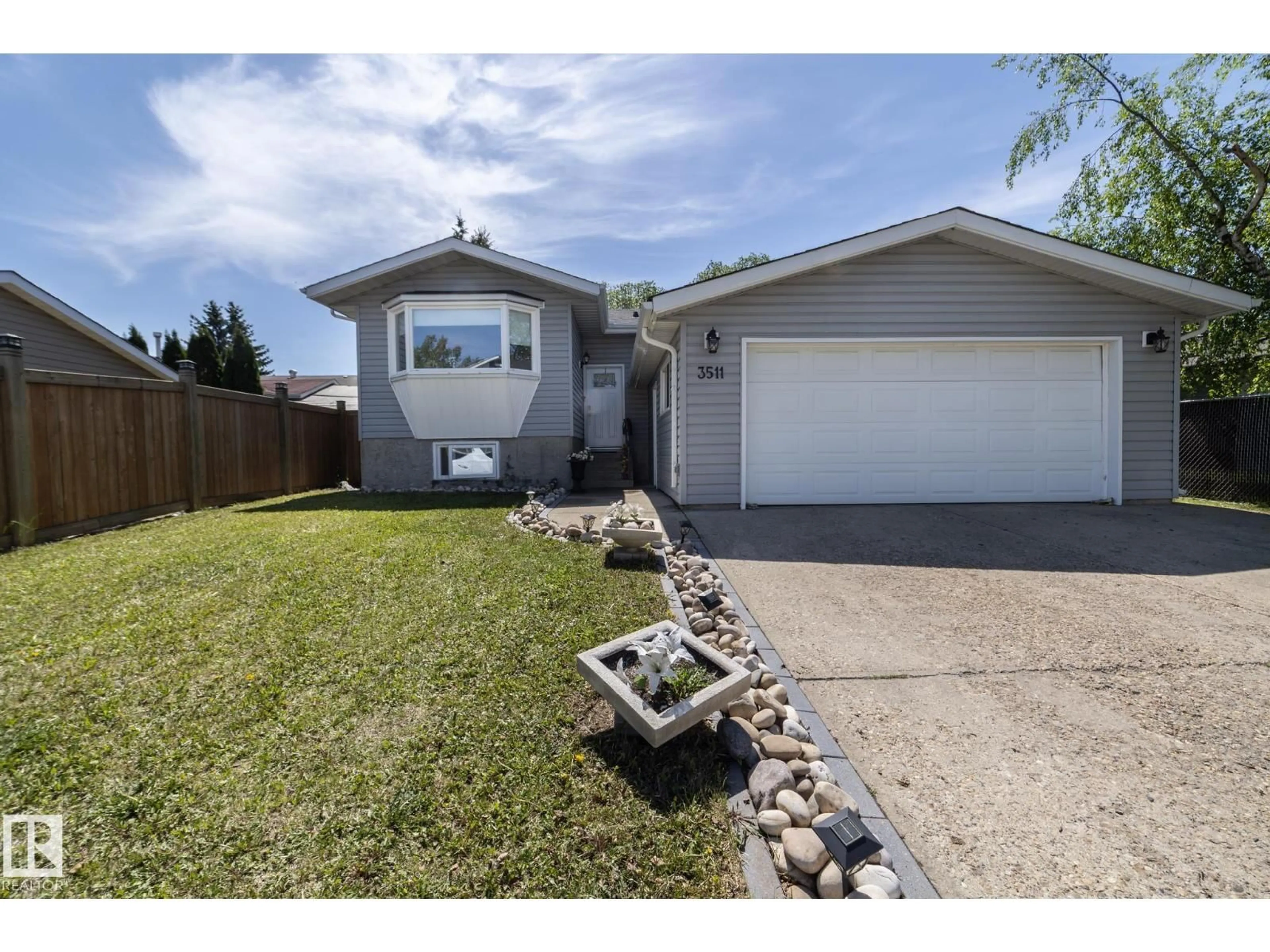 Home with vinyl exterior material, street for NW - 3511 33 AV, Edmonton Alberta T6L4N6