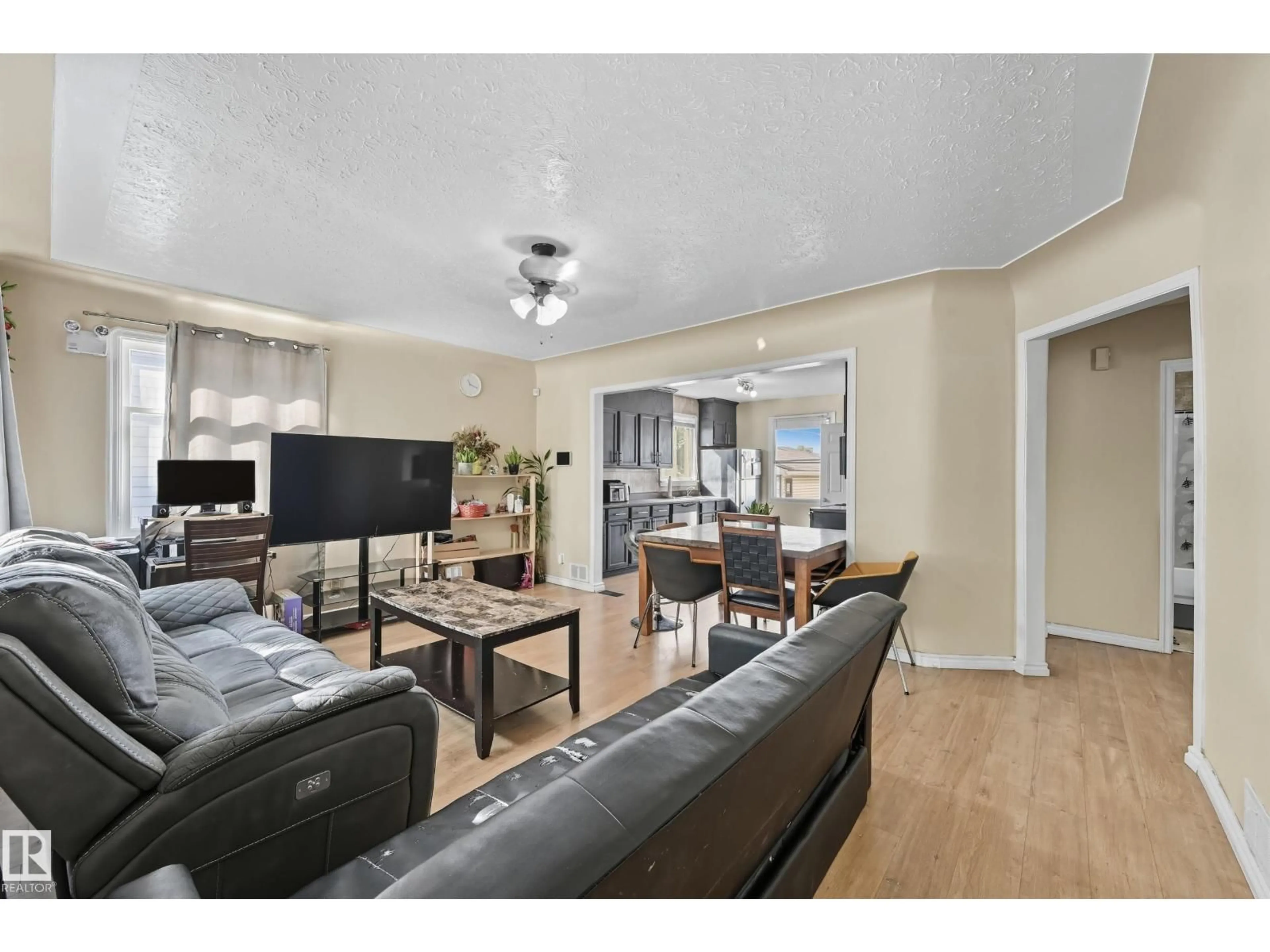 Living room with furniture, wood/laminate floor for 11908 71 ST, Edmonton Alberta T5B1W7