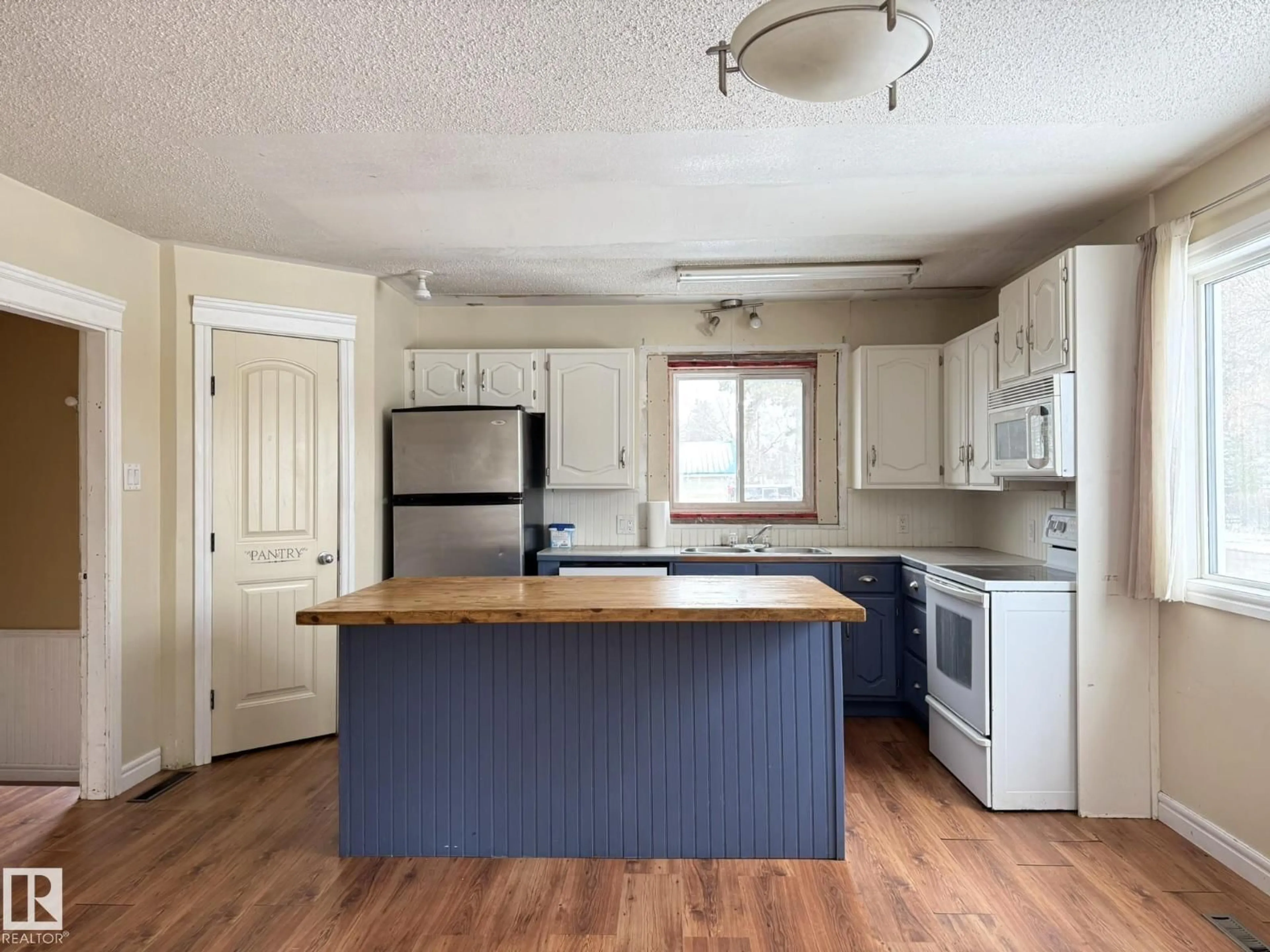 Open concept kitchen, wood/laminate floor for 5116 48 ST, Warburg Alberta T0C2T0
