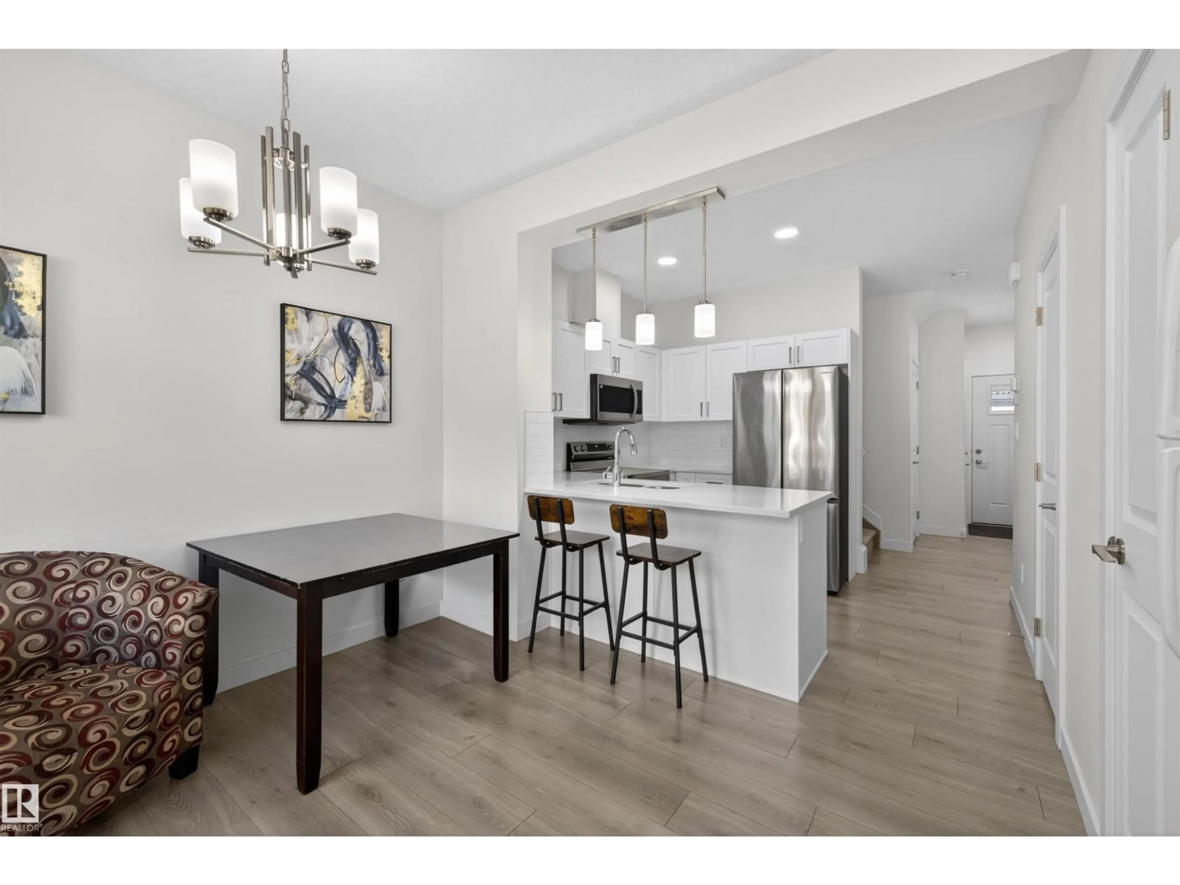 Open concept kitchen, wood/laminate floor for 603 - 51 ORCHARDS BV, Edmonton Alberta T6X2W8