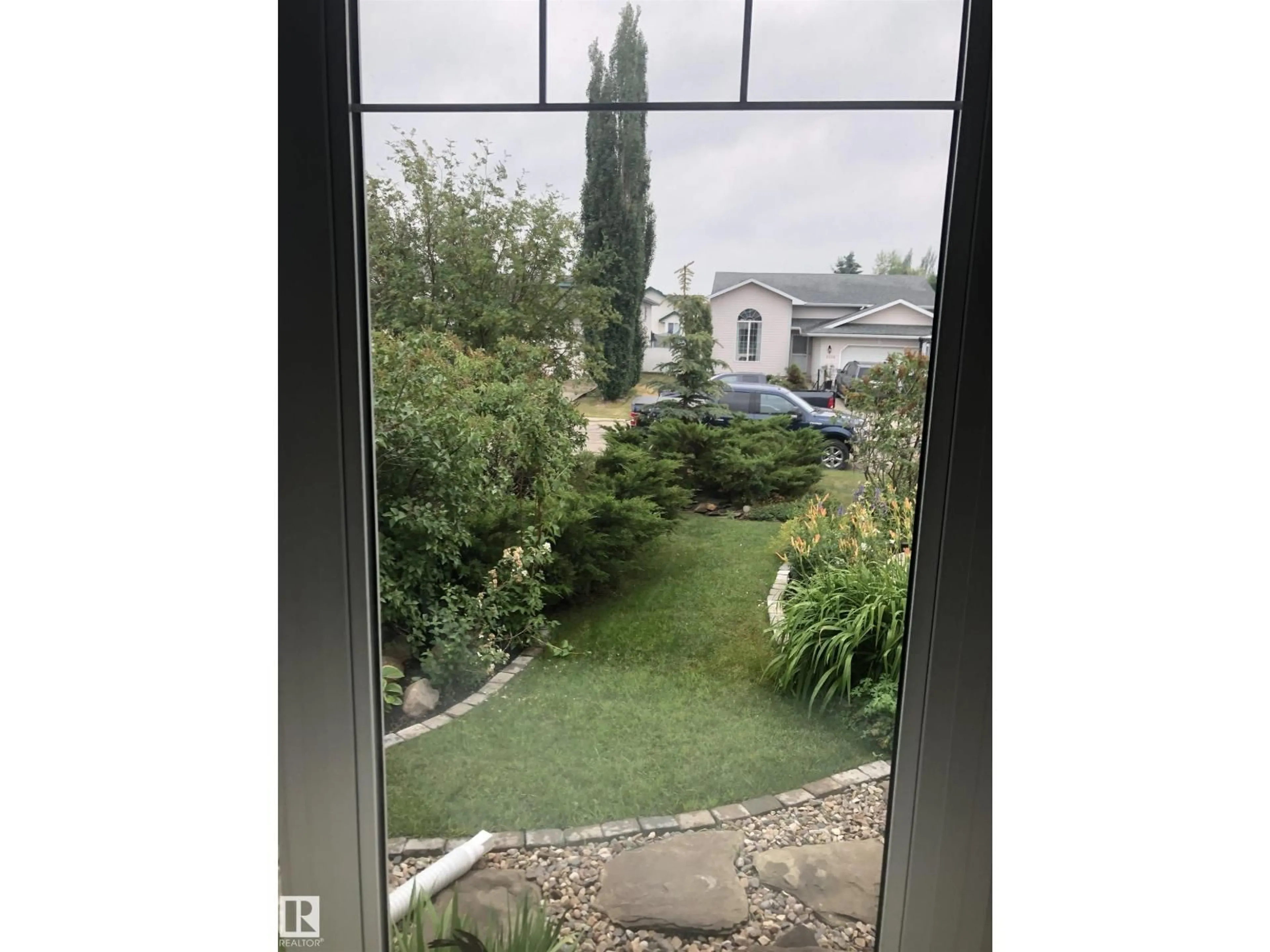 A pic from outside/outdoor area/front of a property/back of a property/a pic from drone, unknown for 9210 97A AV, Morinville Alberta T8R1S5