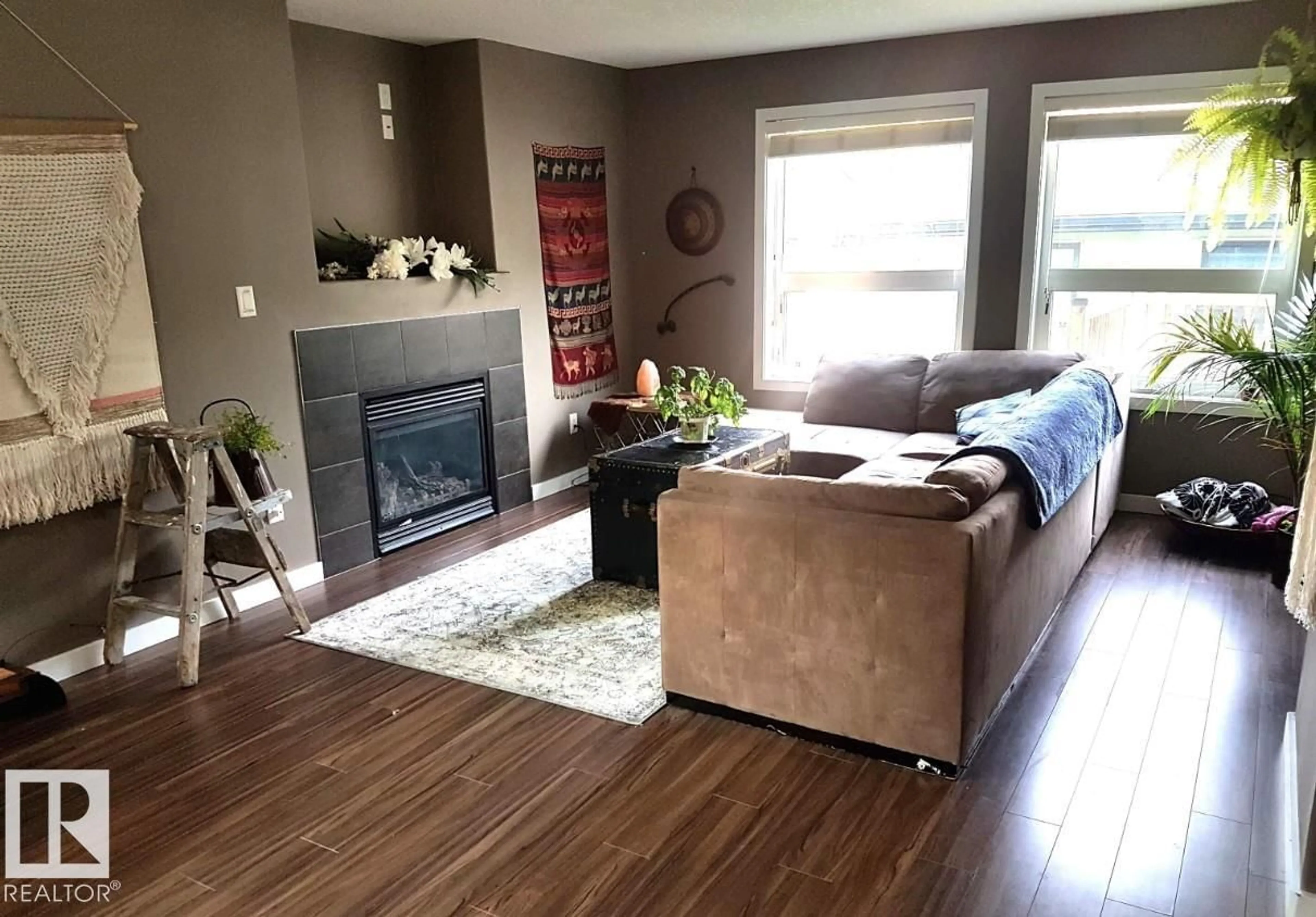 Living room with furniture, wood/laminate floor for NW - 12246 103 ST, Edmonton Alberta T5G2K1