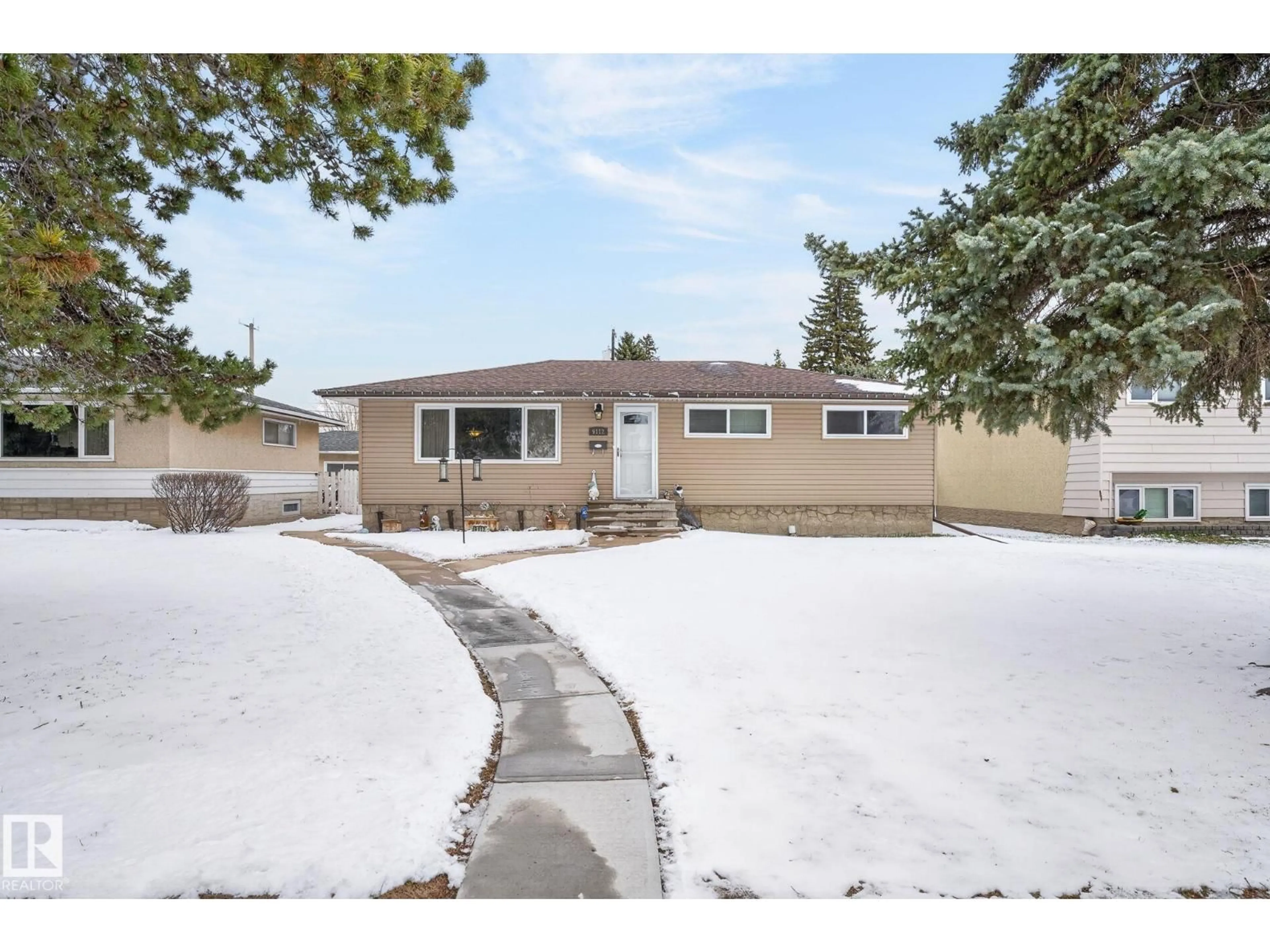 Home with vinyl exterior material, street for 9112 130 AV, Edmonton Alberta T5E0S2