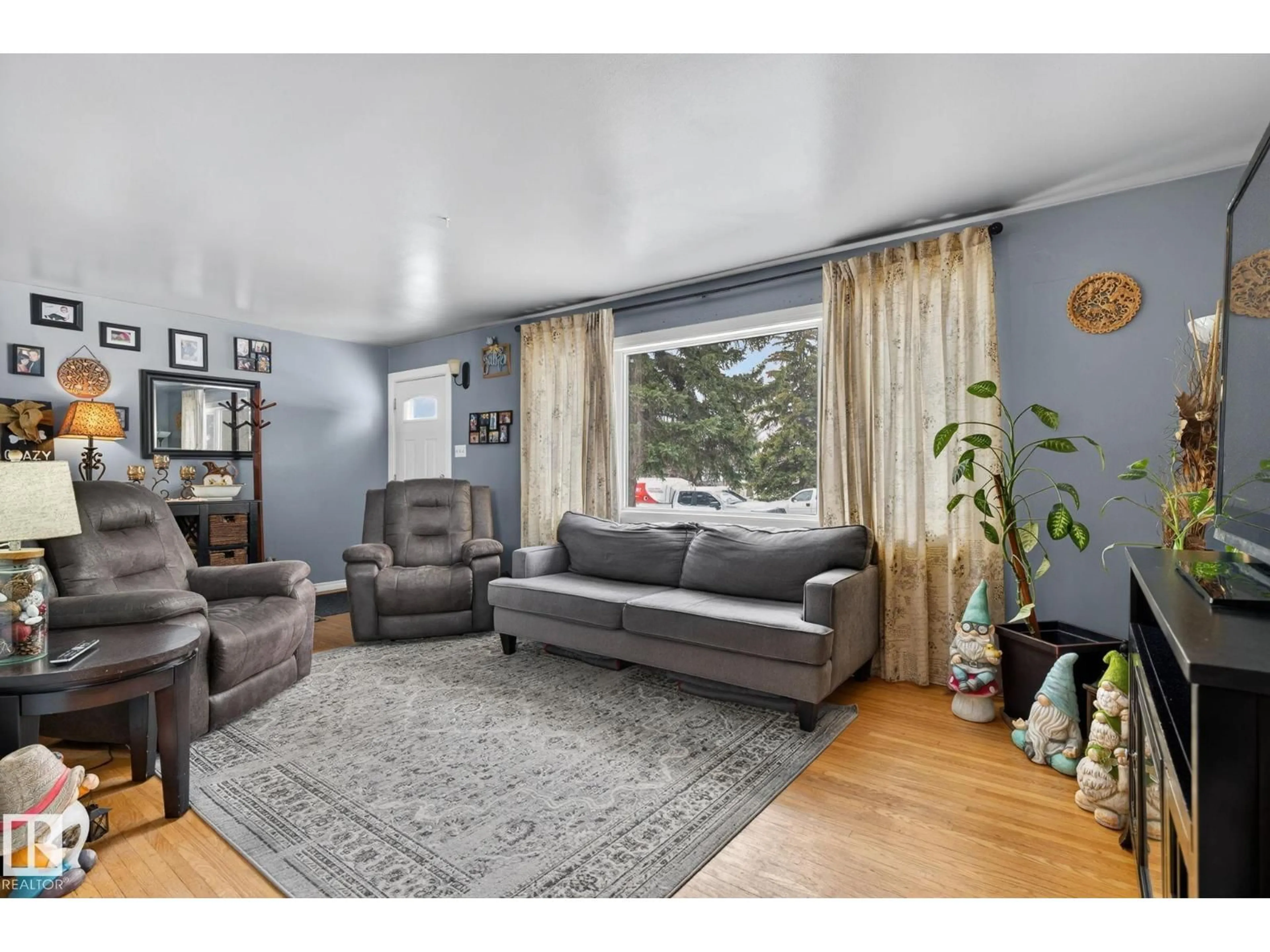 Living room with furniture, unknown for 9112 130 AV, Edmonton Alberta T5E0S2