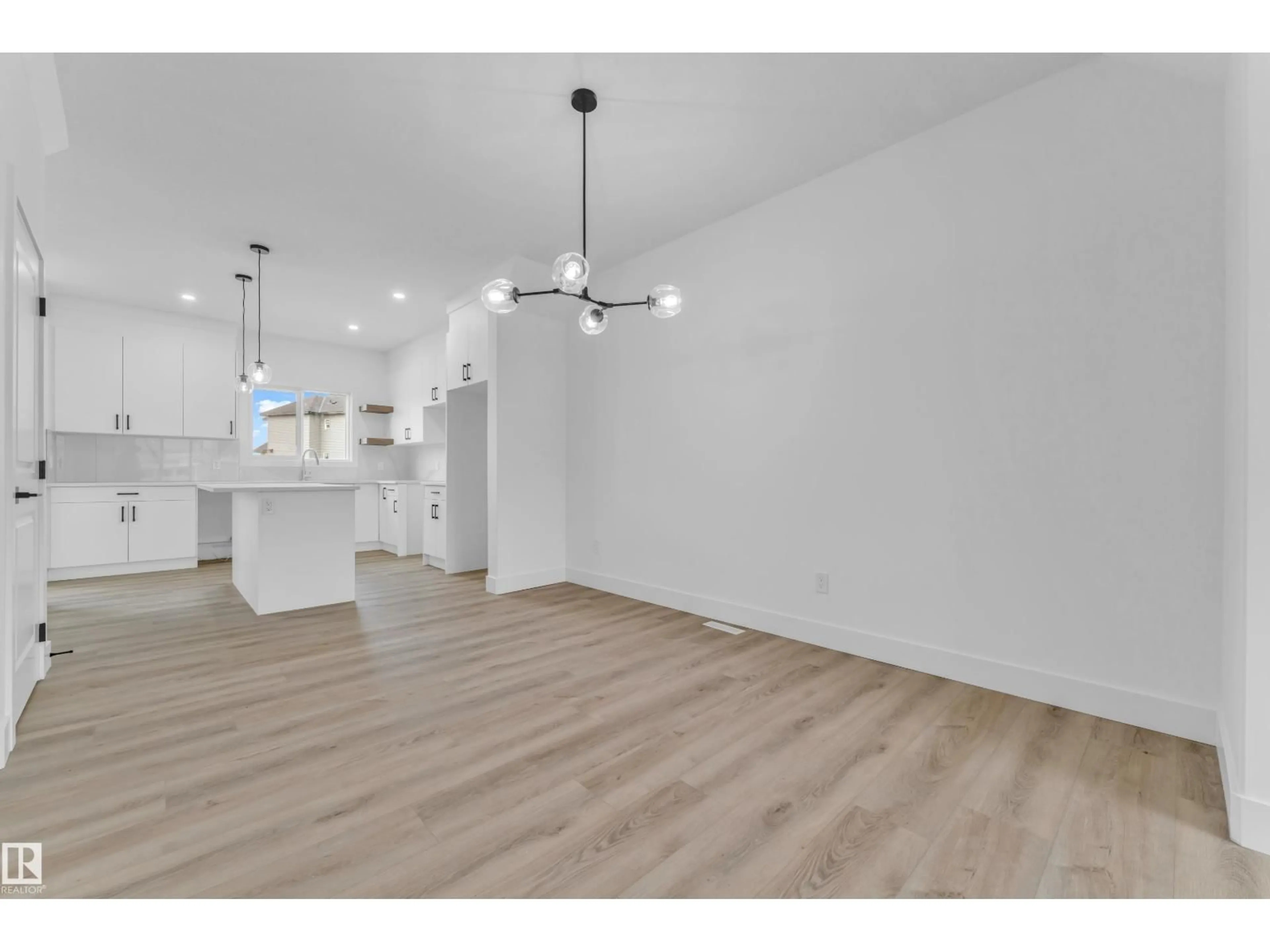 Open concept kitchen, wood/laminate floor for 277 MUNN WY, Leduc Alberta T9E1V1