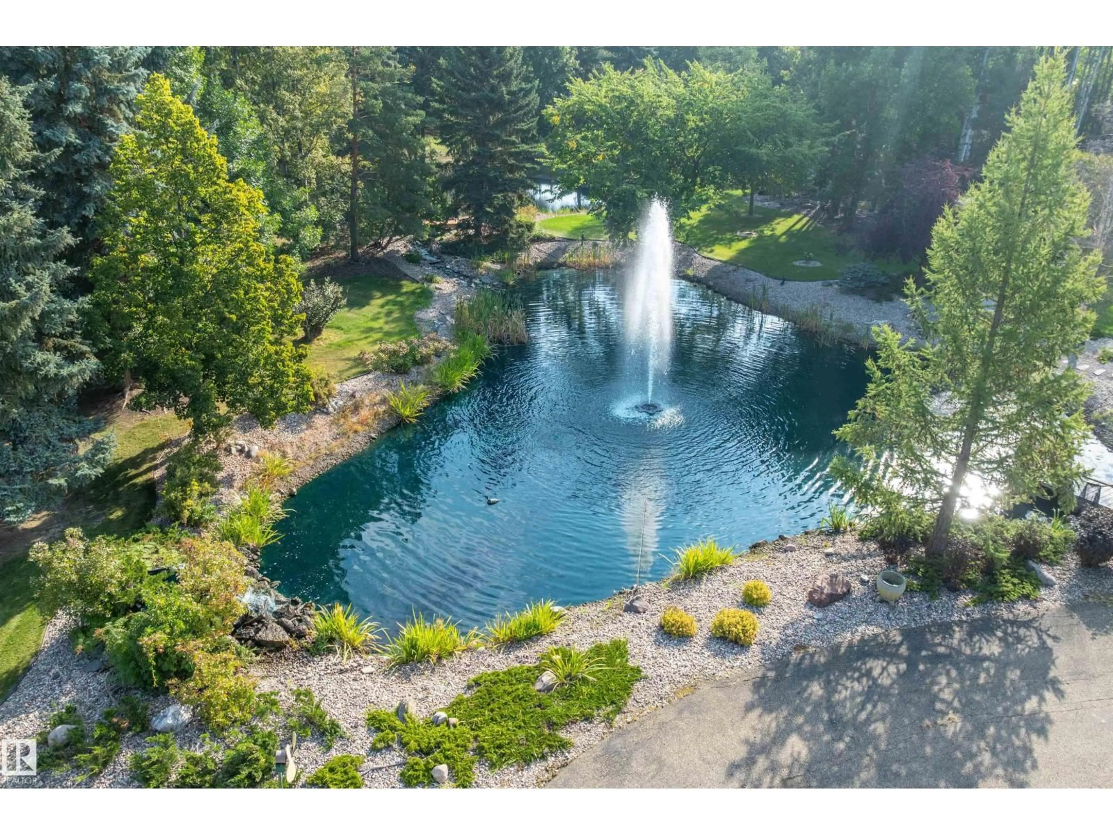 A pic from outside/outdoor area/front of a property/back of a property/a pic from drone, water/lake/river/ocean view for 170 - 50470 RANGE ROAD 234, Rural Leduc County Alberta T4X0L7