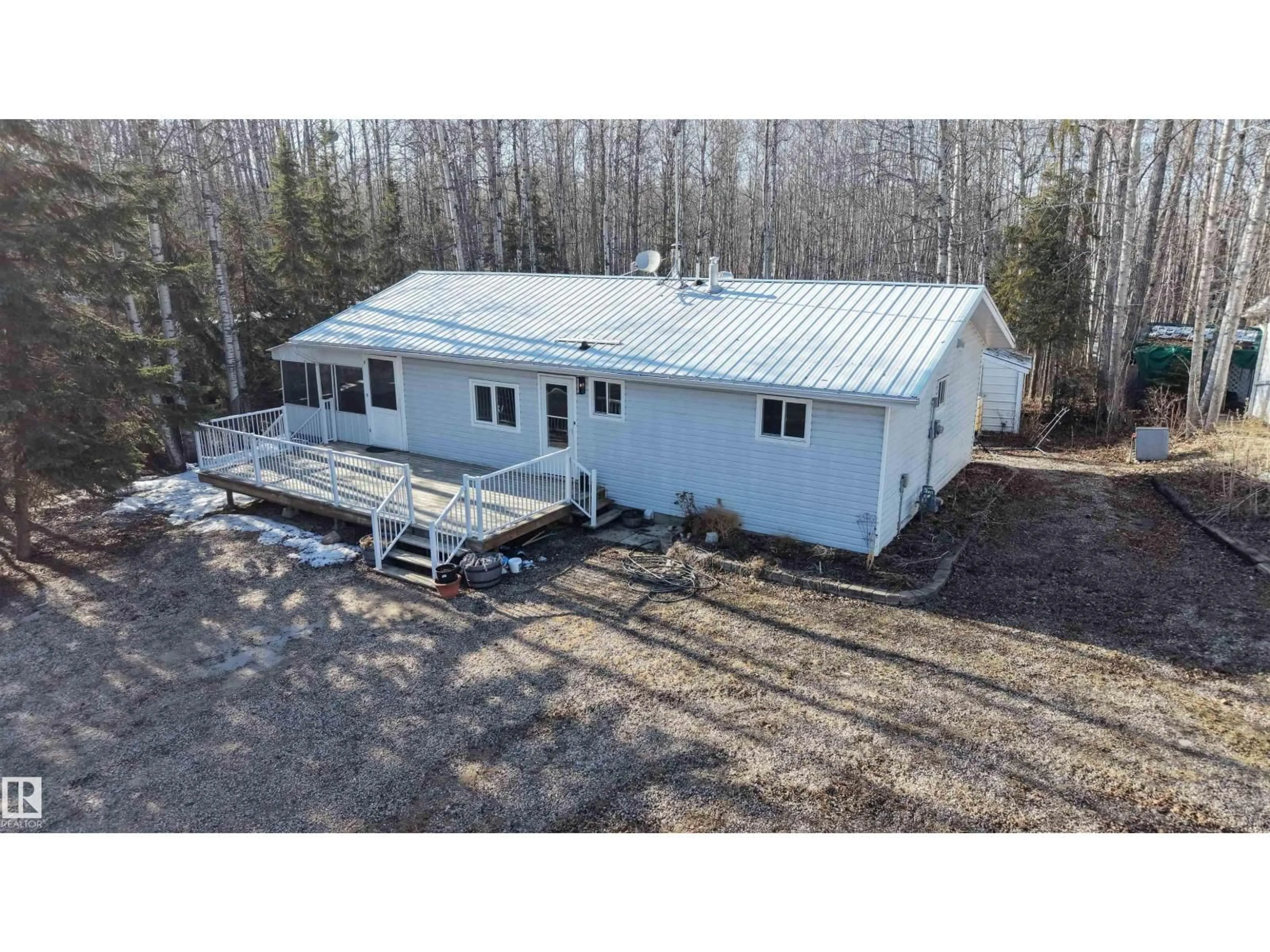 A pic from outside/outdoor area/front of a property/back of a property/a pic from drone, building for 52 5512 TWP 593 A, Rural Barrhead County Alberta T7N1N3