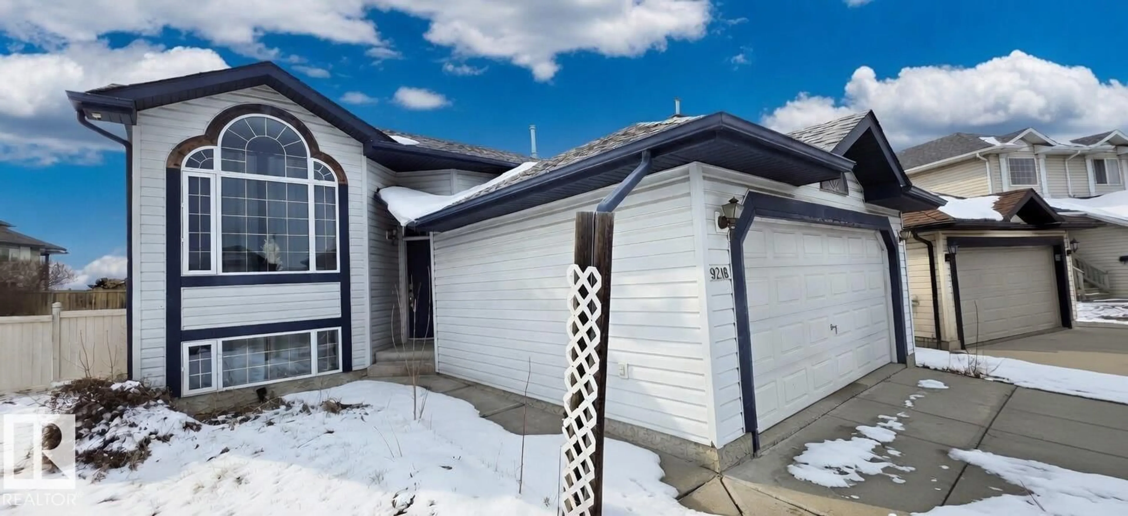 Home with vinyl exterior material, street for 9218 163 AV, Edmonton Alberta T5Z3M8