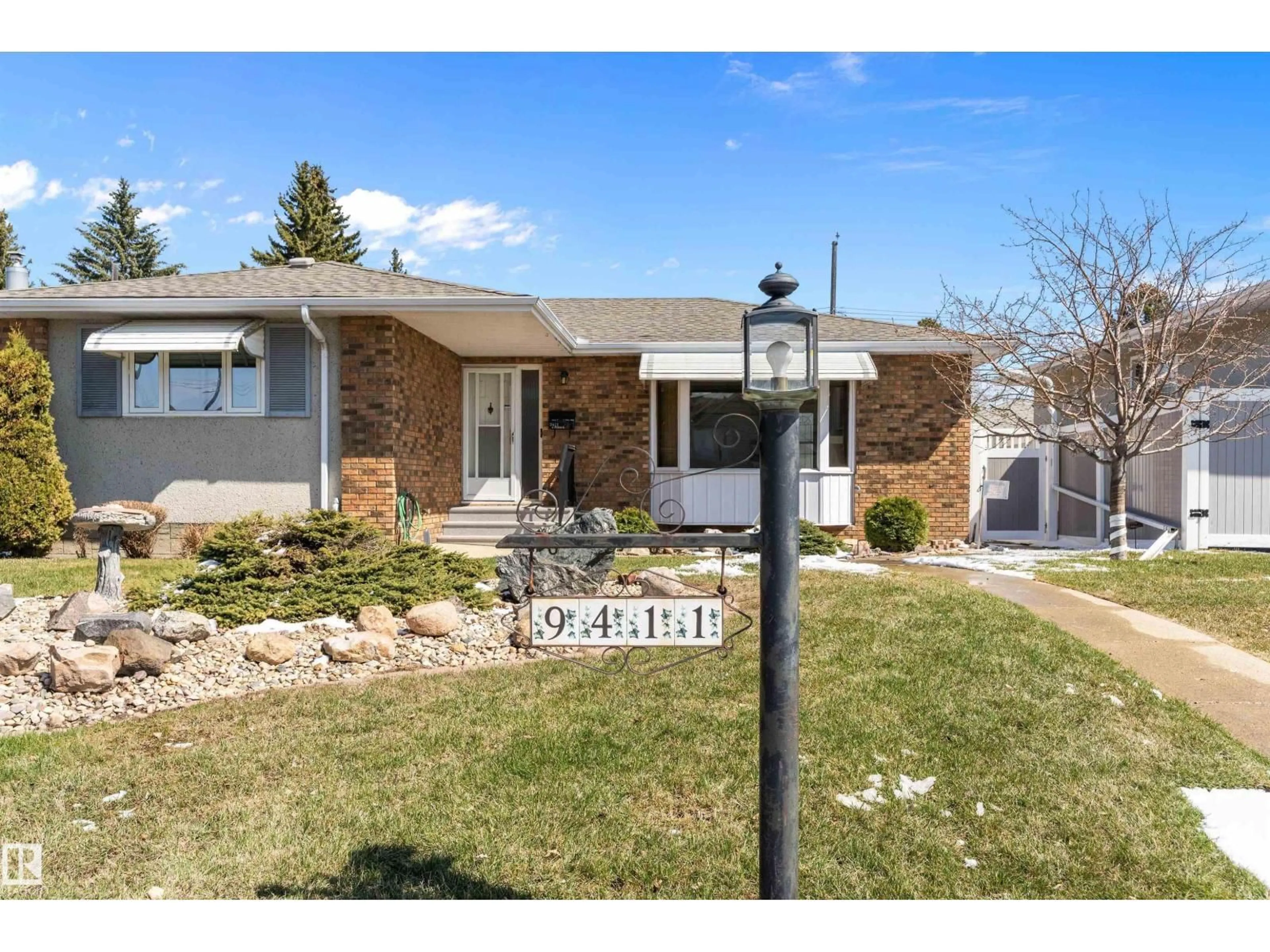 Home with brick exterior material, street for NW - 9411 68A ST, Edmonton Alberta T6B1T9