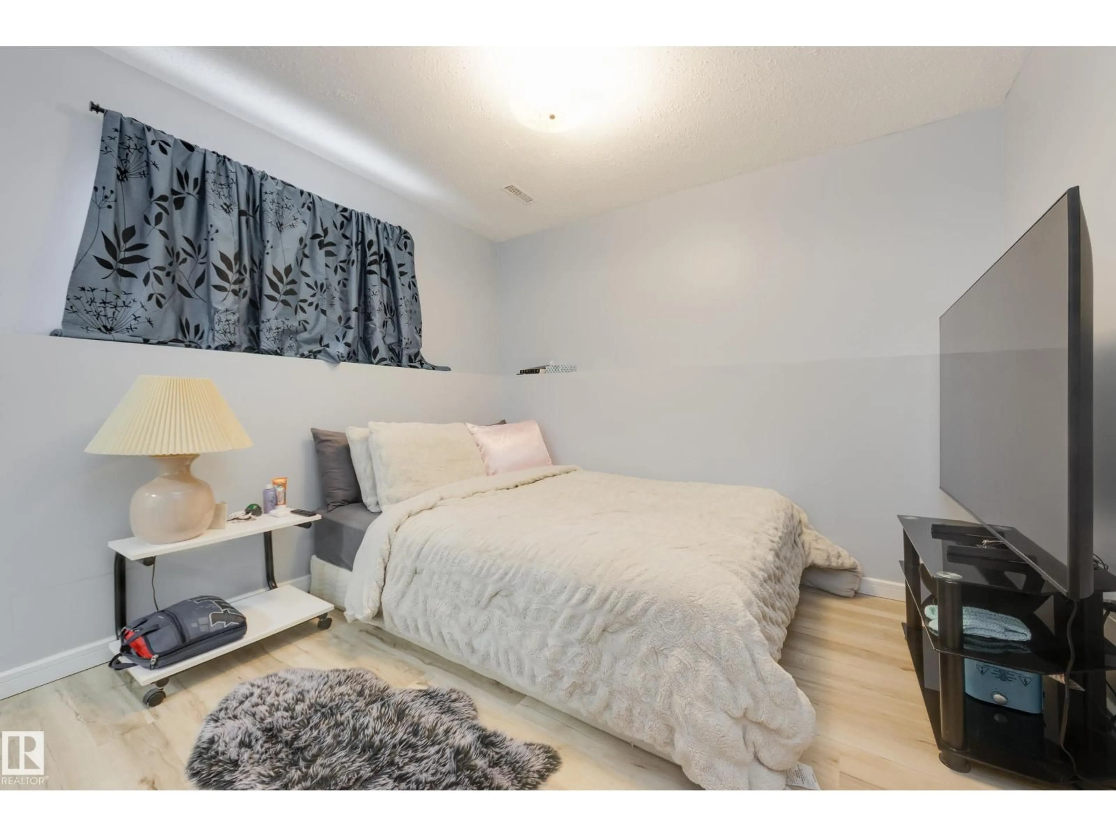 Bedroom with bed, wood/laminate floor for 12775 116 ST, Edmonton Alberta T5E5H1