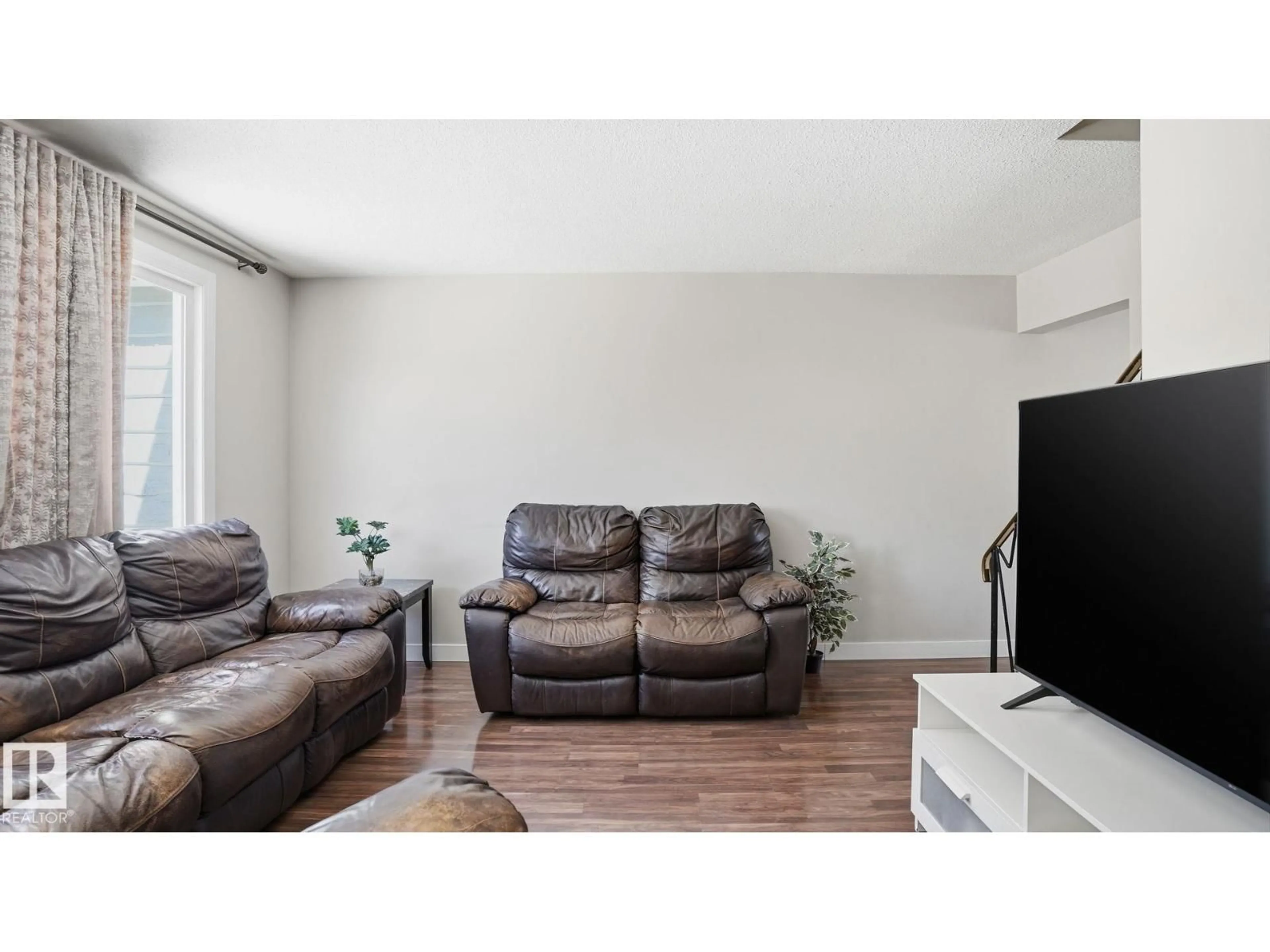 Living room with furniture, wood/laminate floor for 164 MAYFAIR MEWS ME, Edmonton Alberta T5E5R7