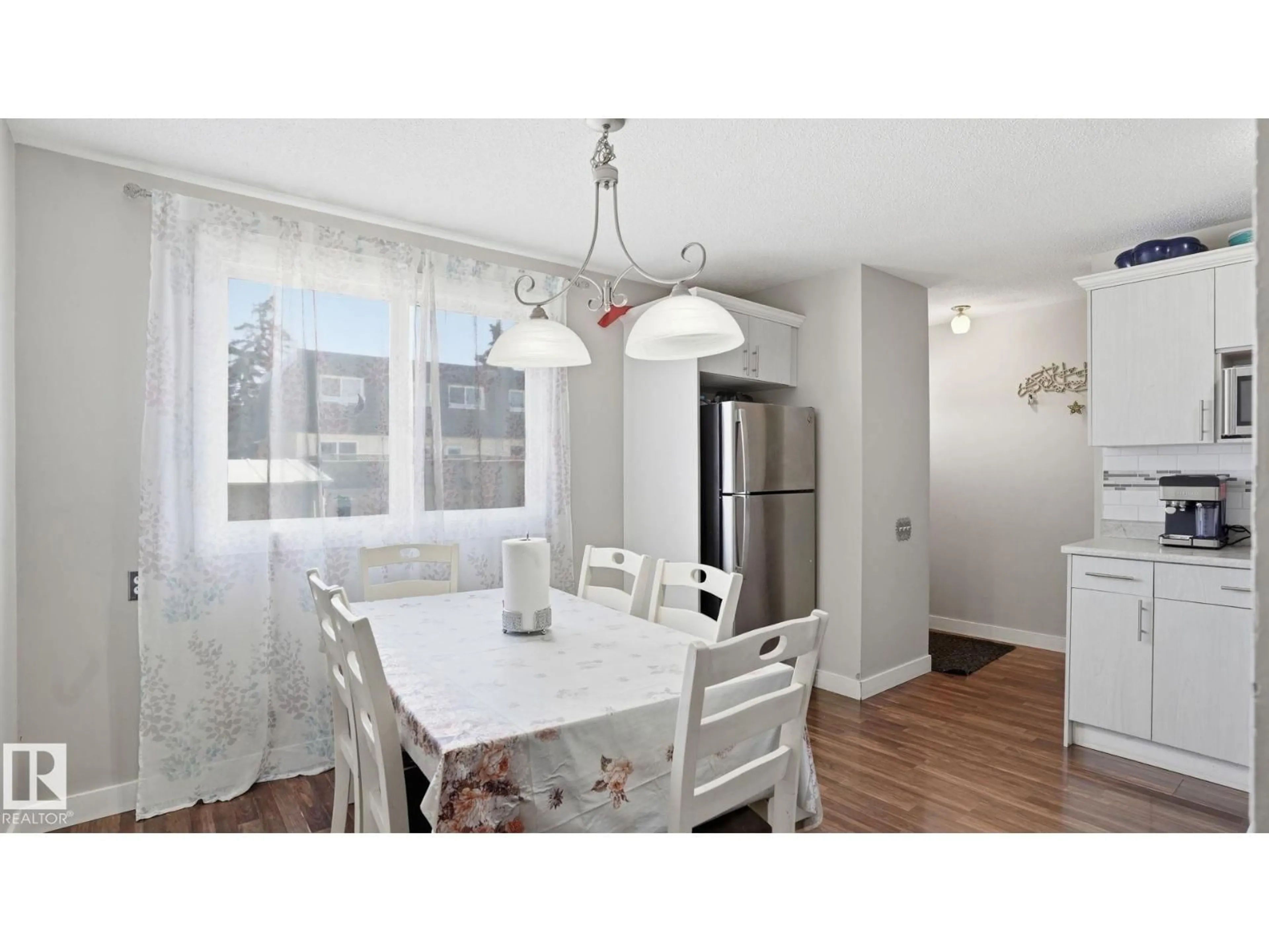 Dining room, wood/laminate floor for 164 MAYFAIR MEWS ME, Edmonton Alberta T5E5R7