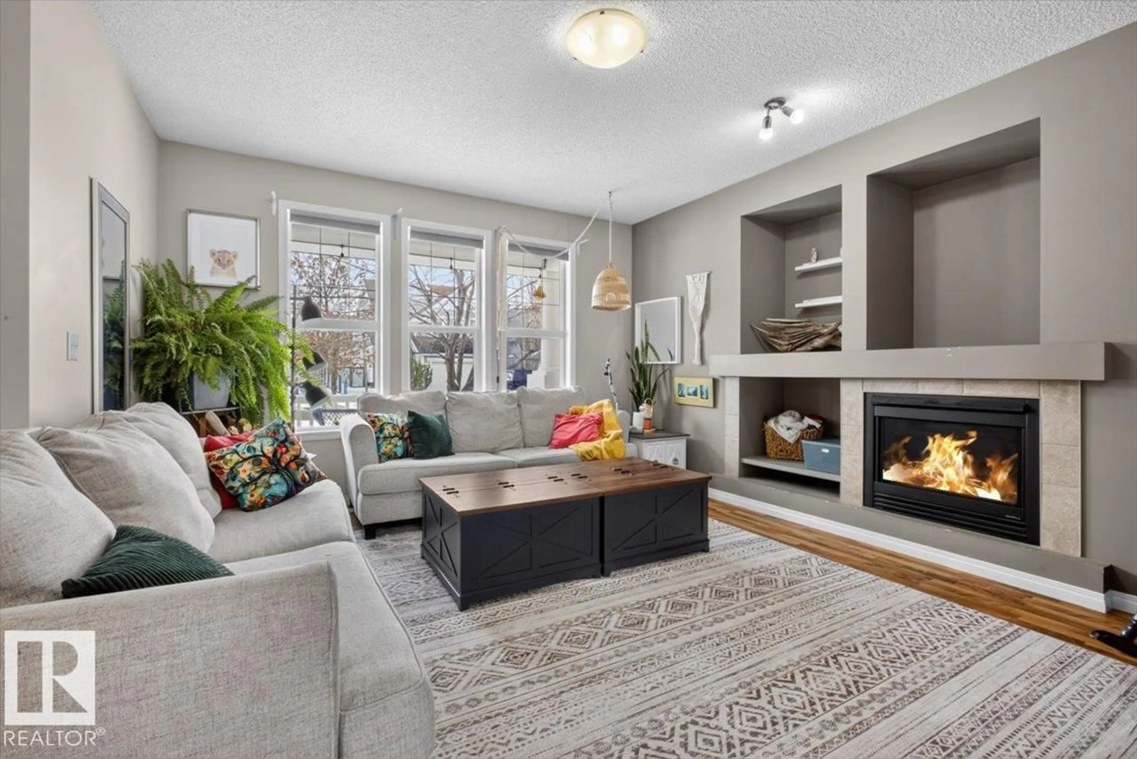 Living room with furniture, unknown for 7704 16 AV, Edmonton Alberta T6X1M2
